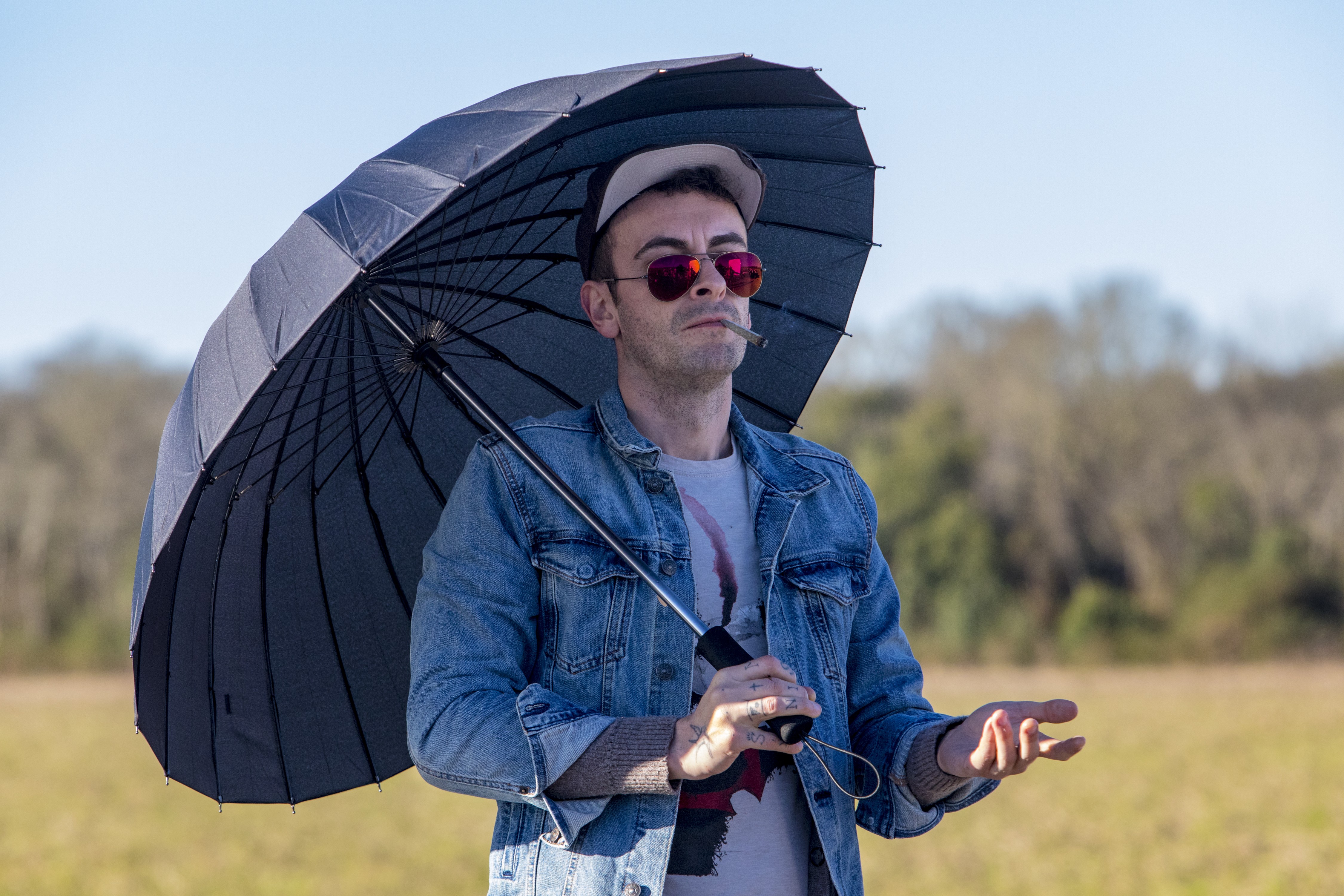 Joseph Gilgun holding an umbrella HD Wallpaper