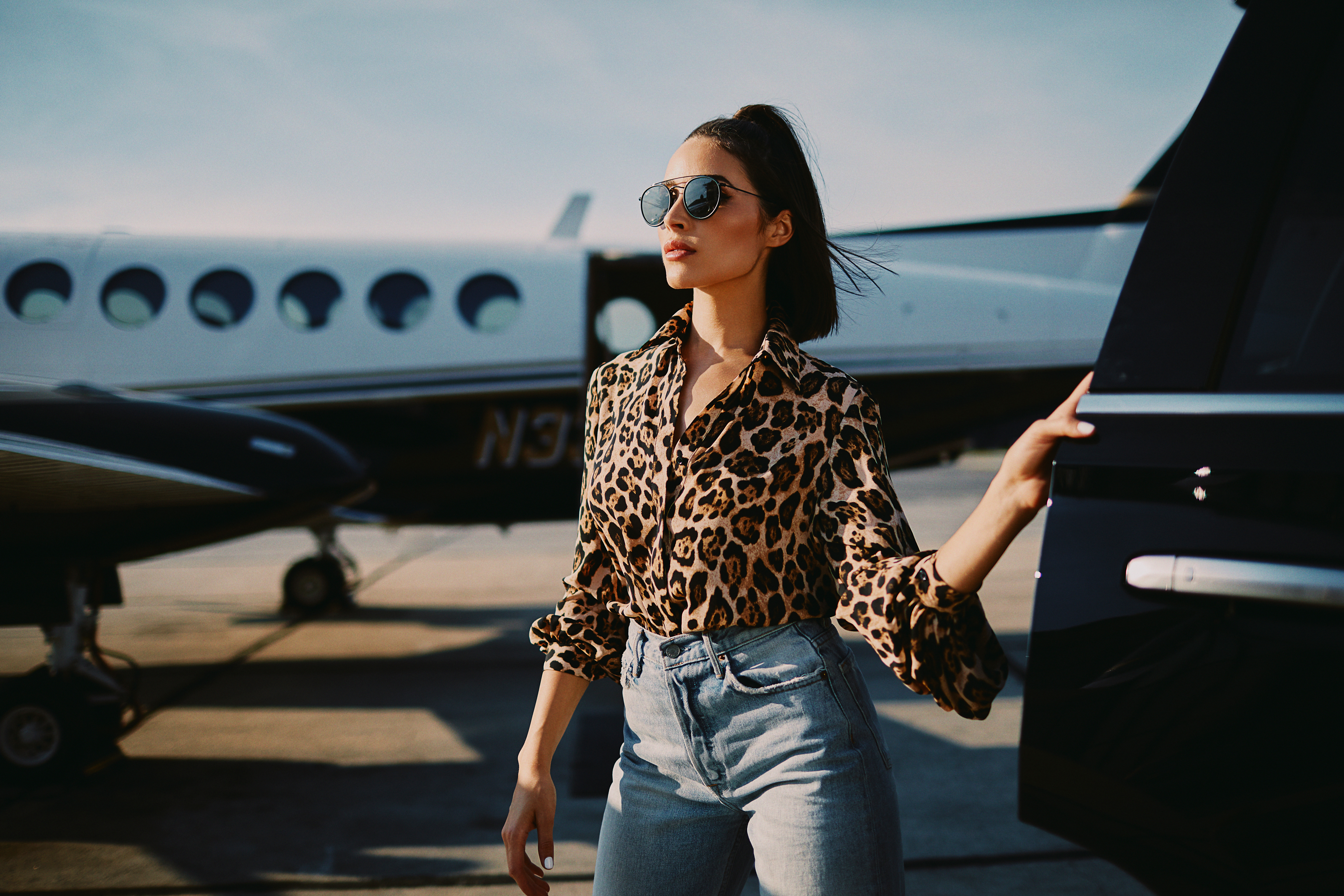 Olivia Culpo by a private jet HD Wallpaper