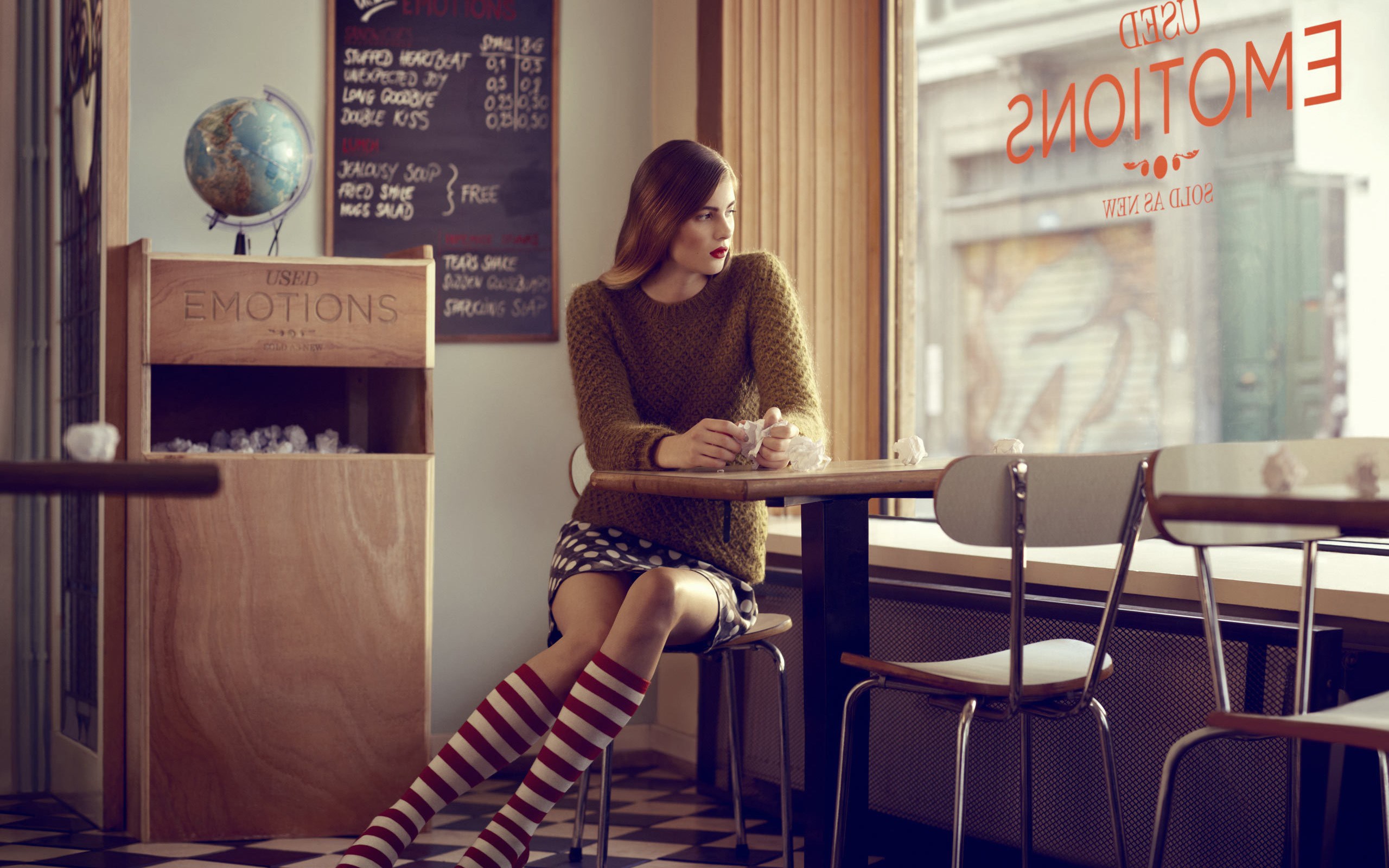 Woman in cafe with menu and globe HD Wallpaper