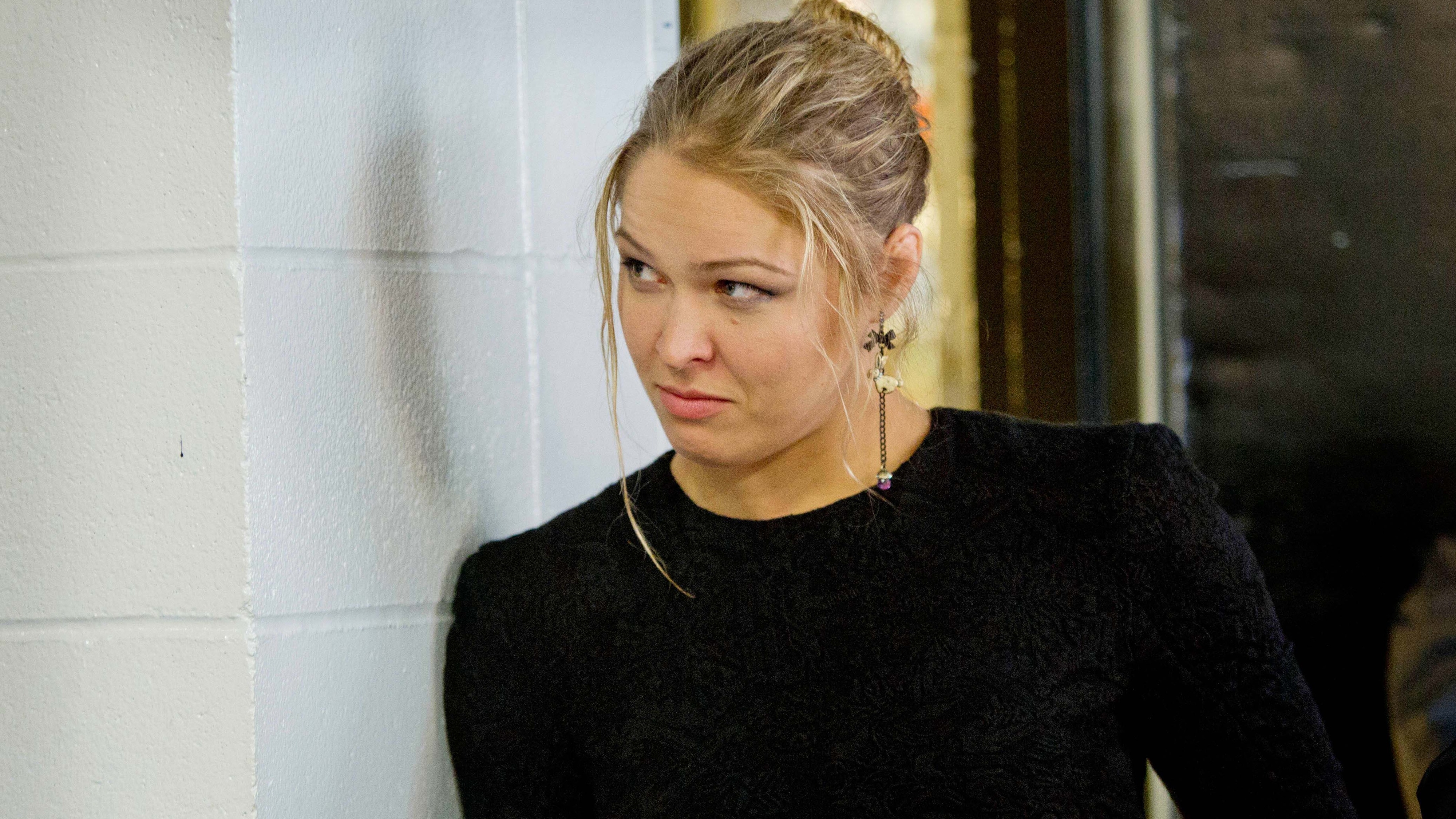 Ronda Rousey leaning against a wall HD Wallpaper