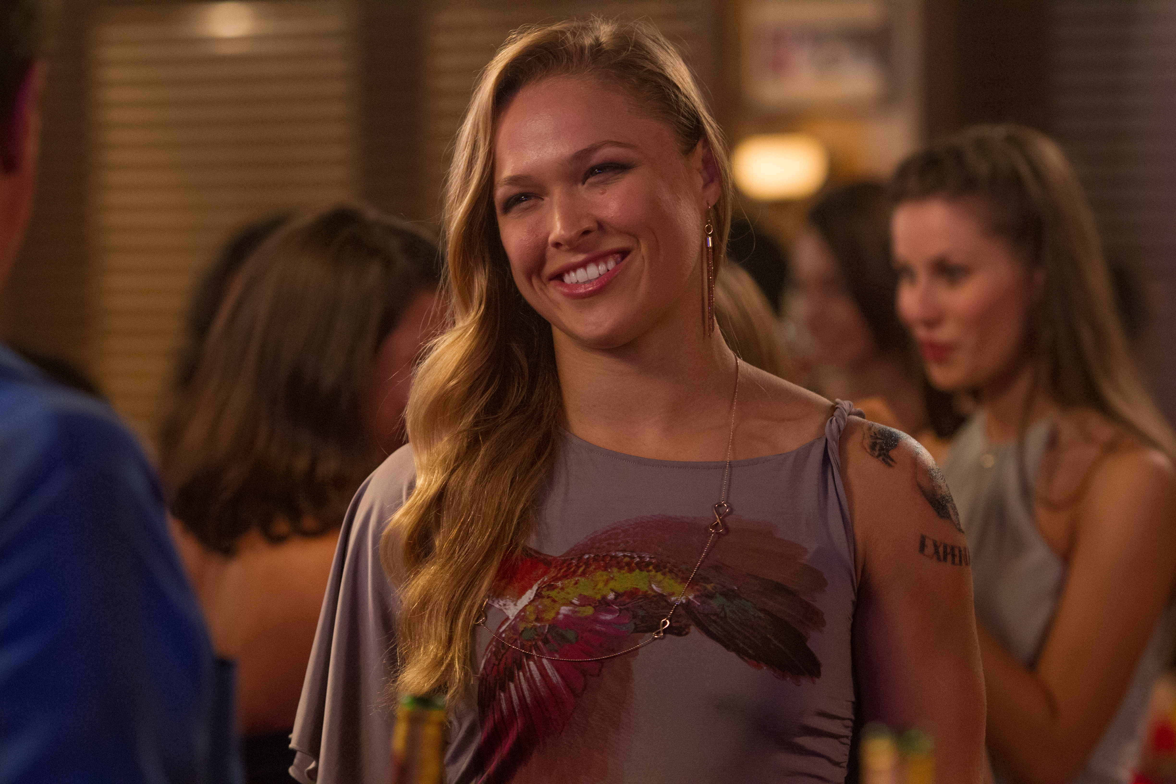 Ronda Rousey in a purple dress with a bird print HD Wallpaper