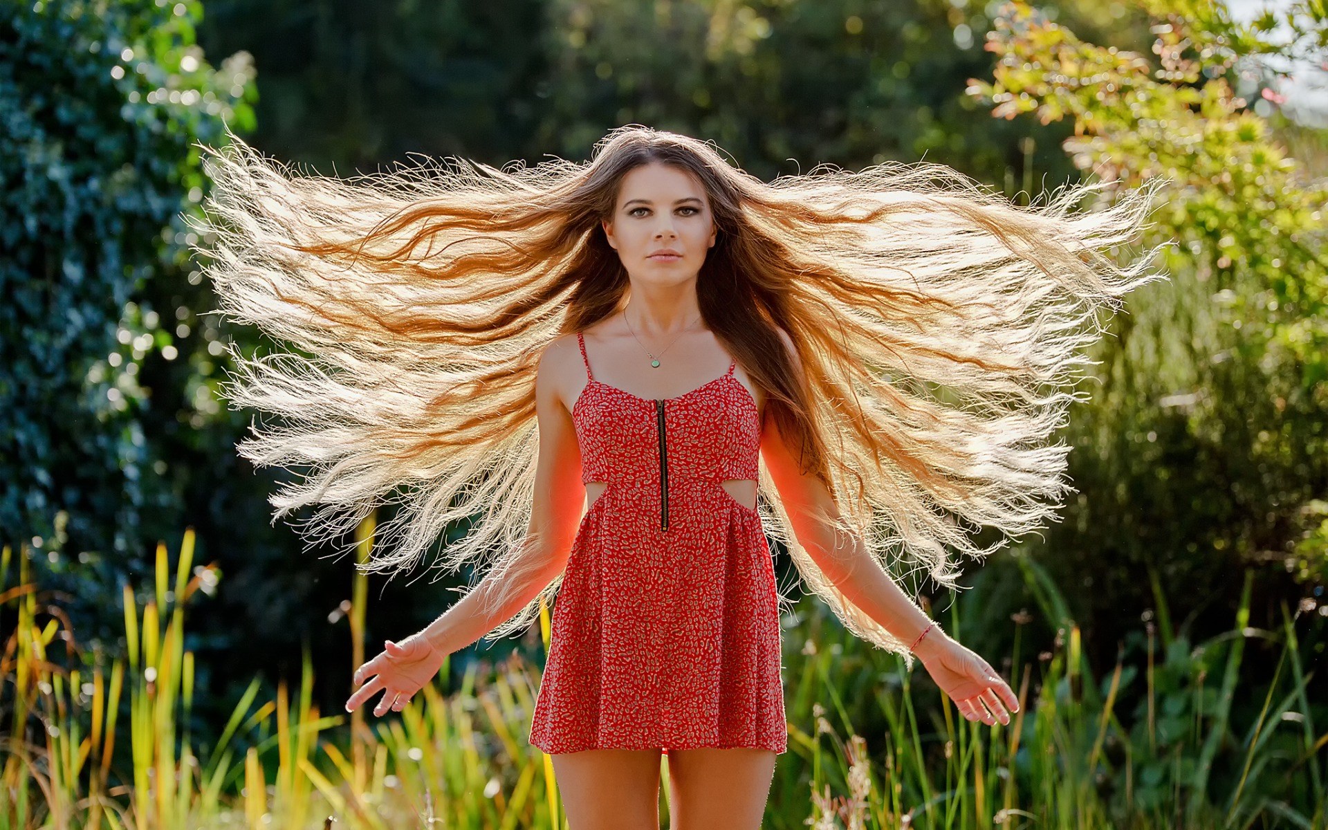 Woman with long hair in a red dress outdoors HD Wallpaper