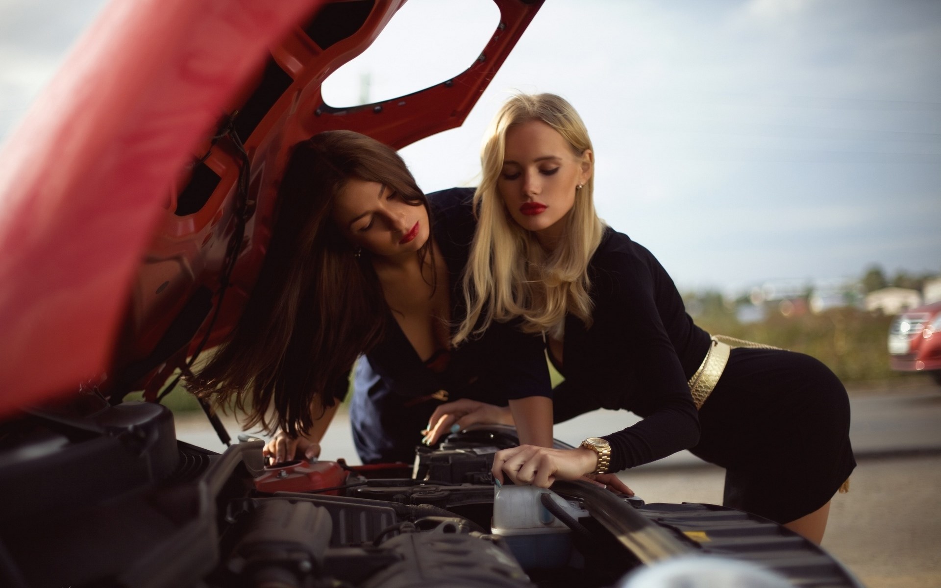Two women looking at car engine HD Wallpaper