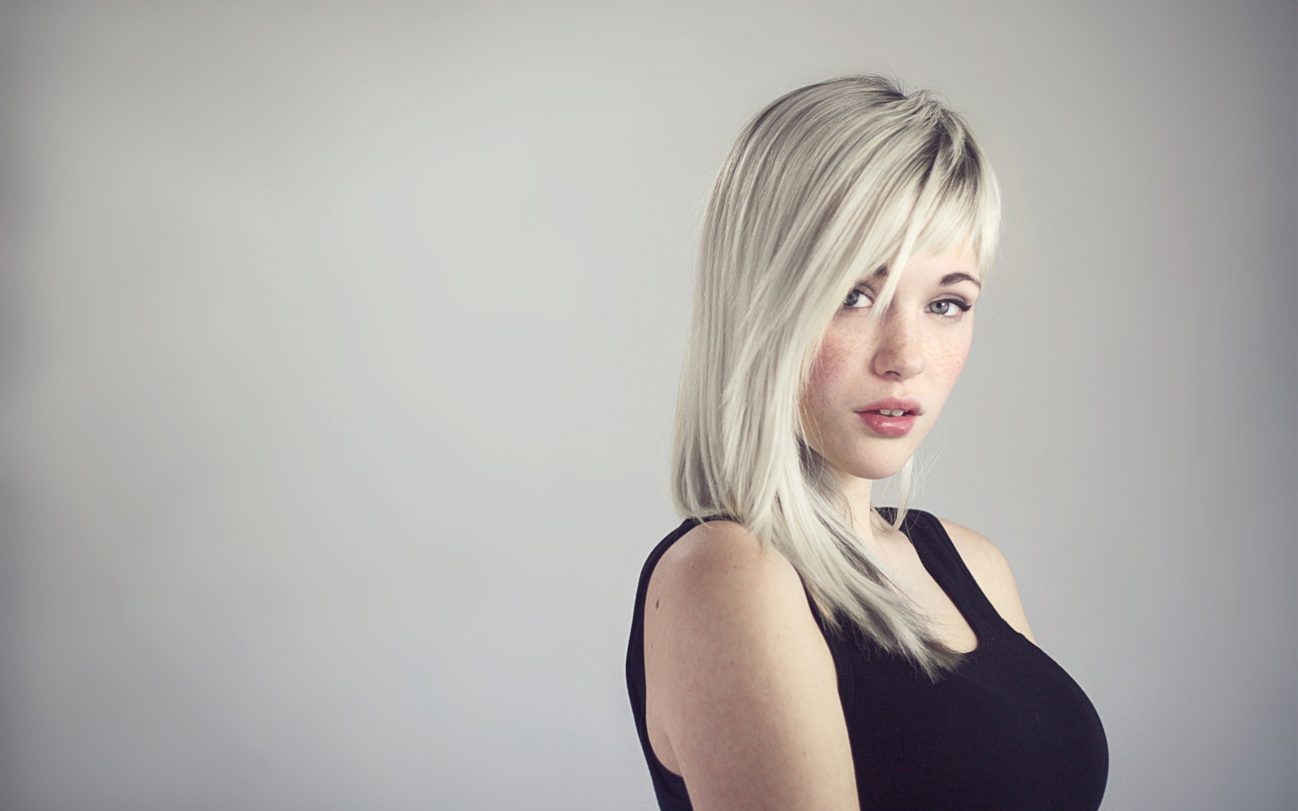 Woman with blonde hair wearing a black tank top HD Wallpaper