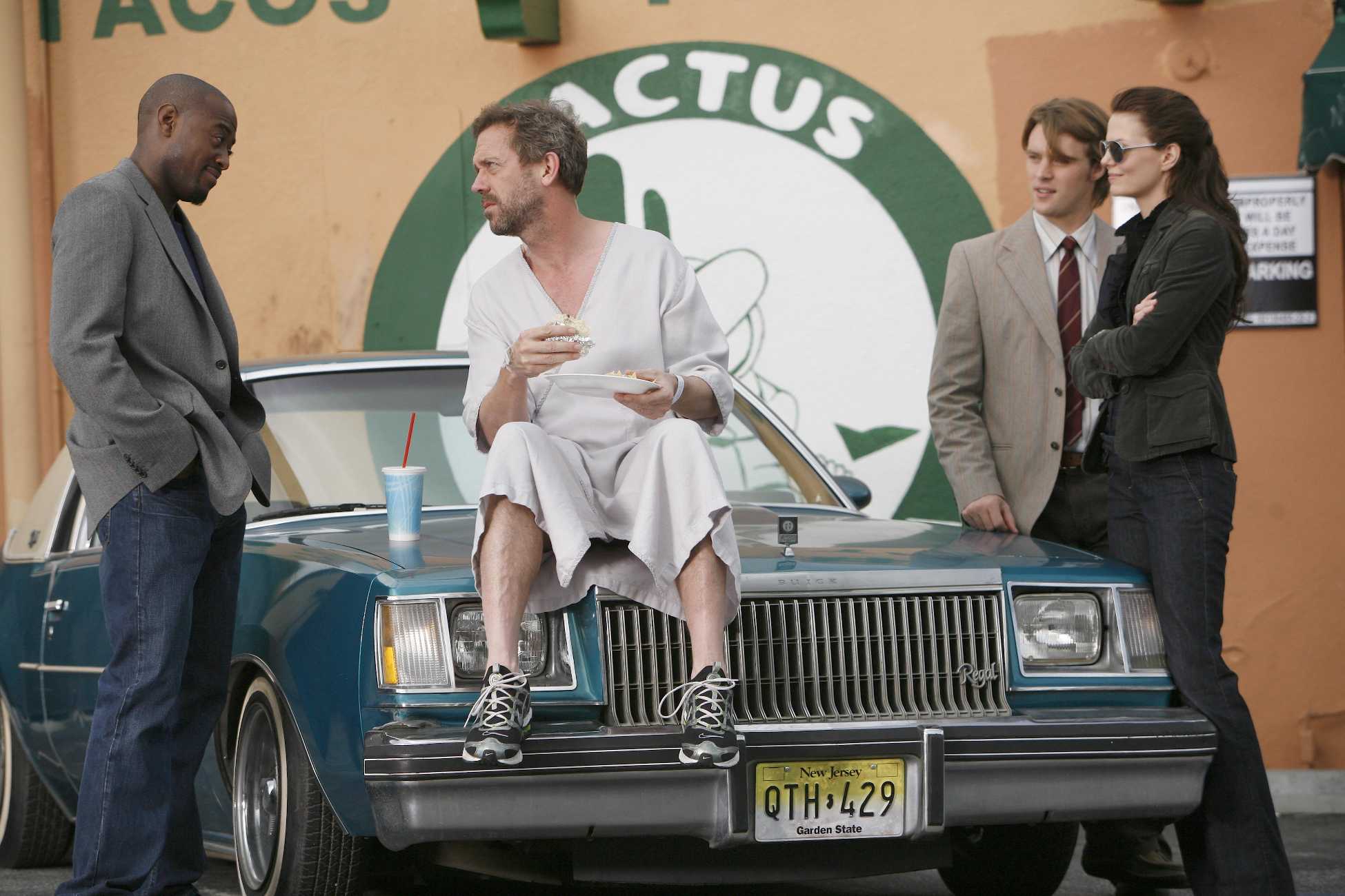 Four people by a car with Cactus sign HD Wallpaper