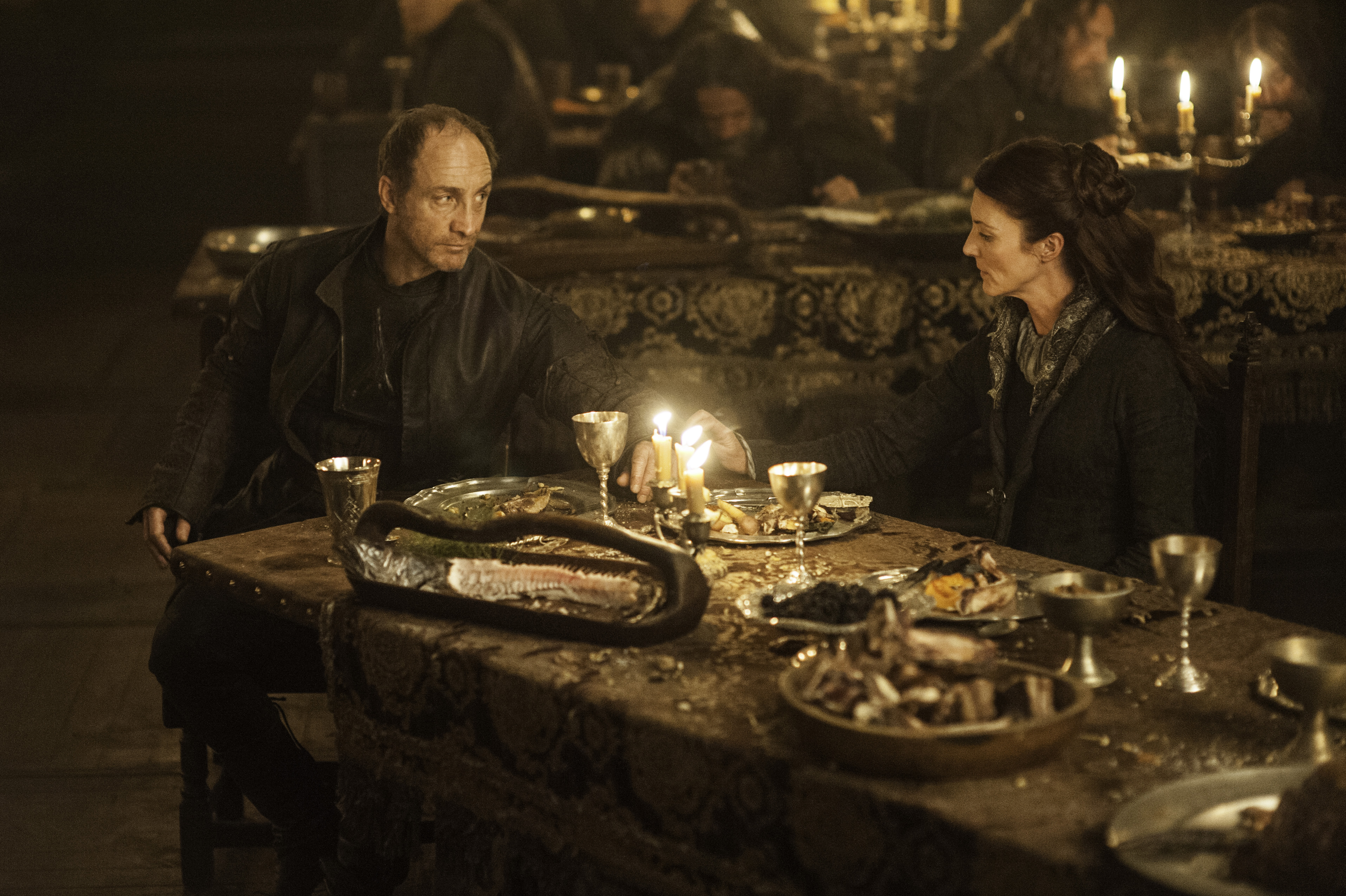 Michelle Fairley and man at a feast HD Wallpaper