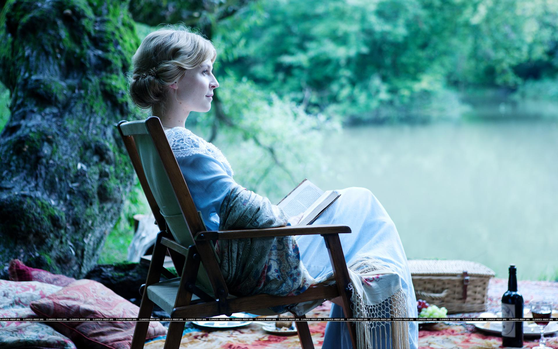 Clémence Poésy reading by a lake HD Wallpaper