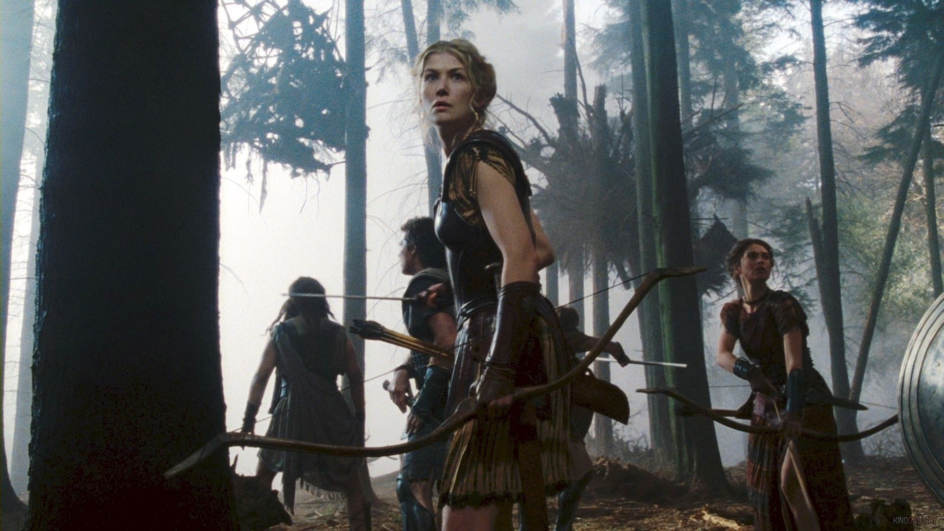 Rosamund Pike and Amazon warriors in a forest HD Wallpaper