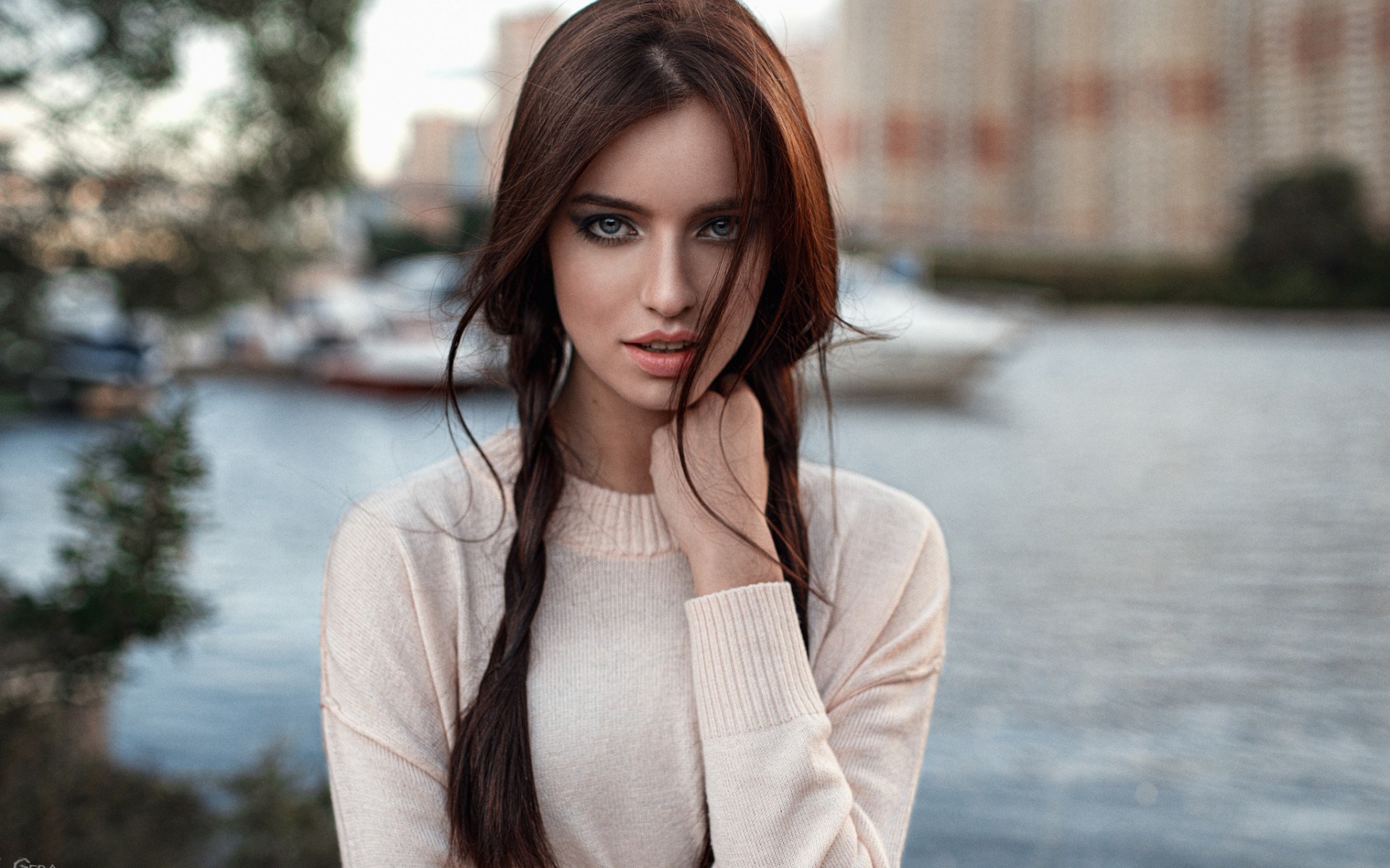 Woman with braided hair by the water HD Wallpaper