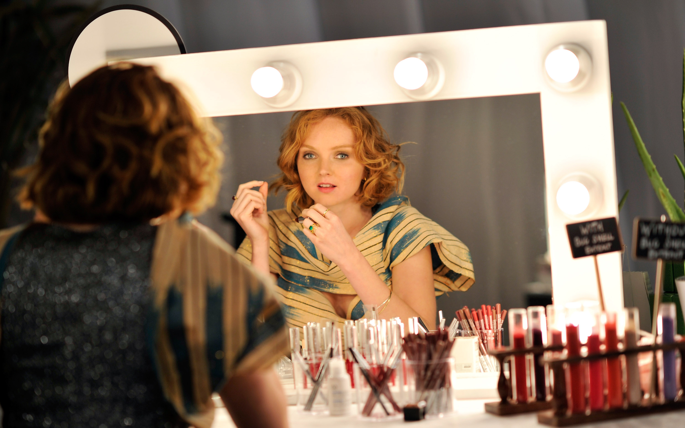Lily Cole in front of a lighted mirror HD Wallpaper