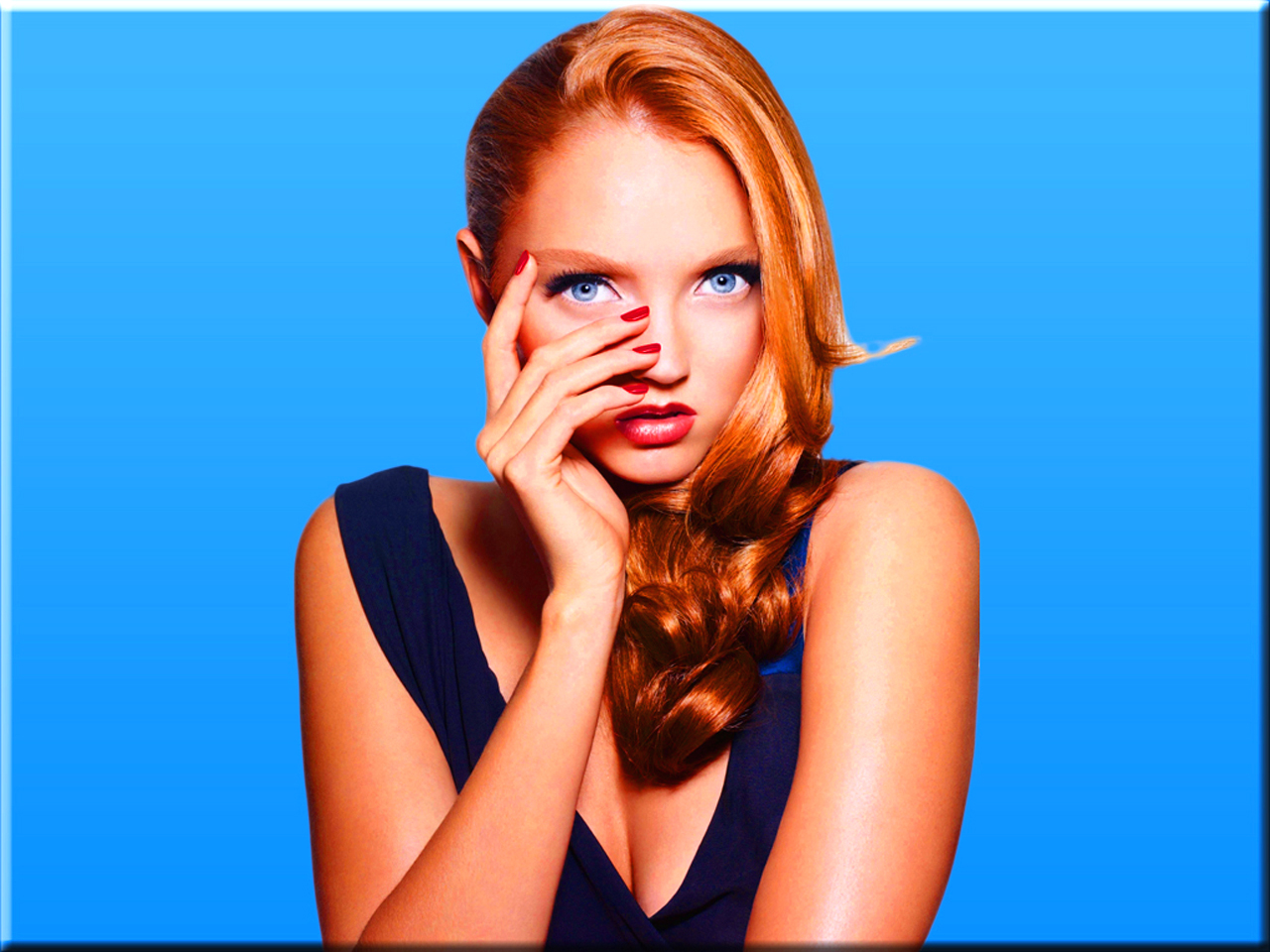 Lily Cole posing against a blue background HD Wallpaper