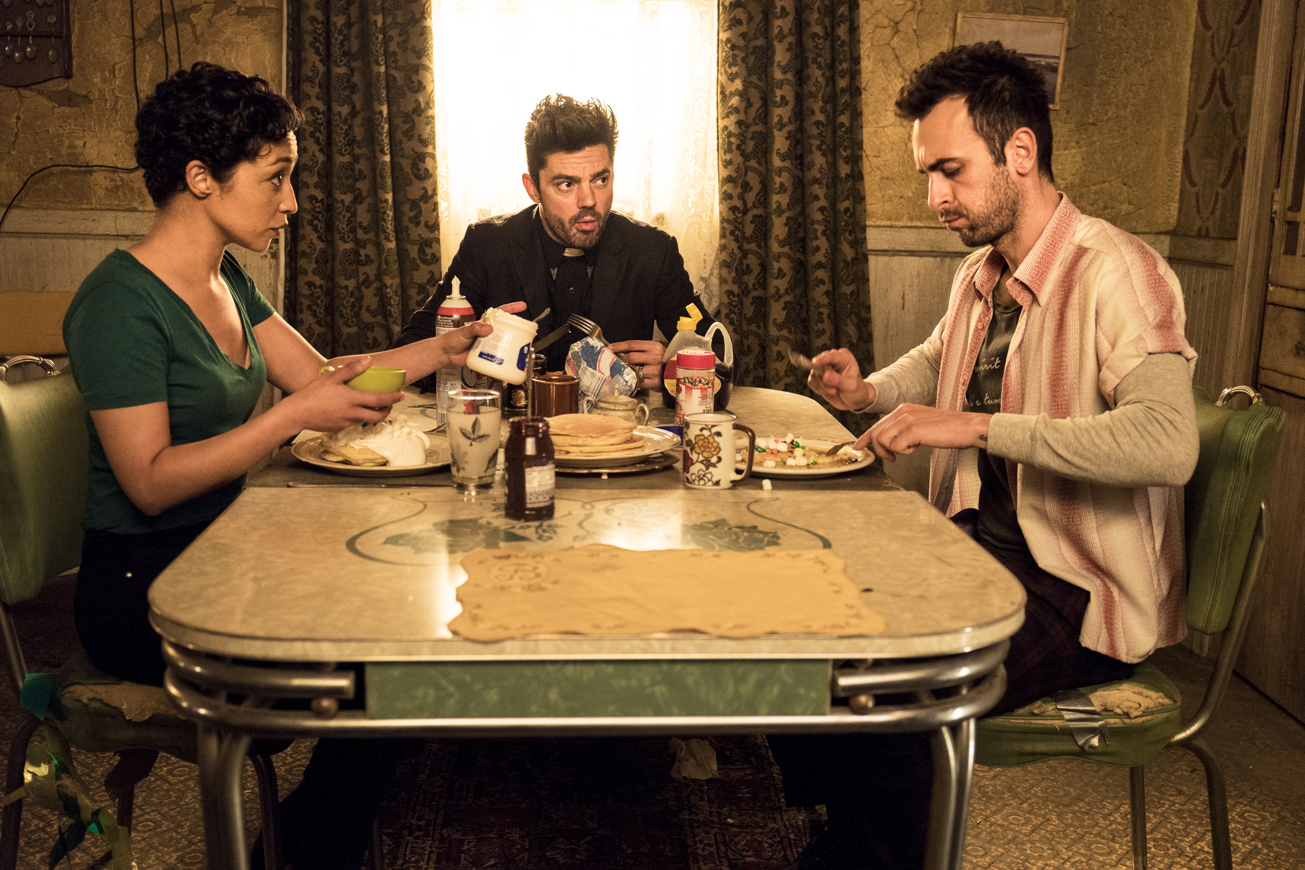 Ruth Negga and two men at a table HD Wallpaper