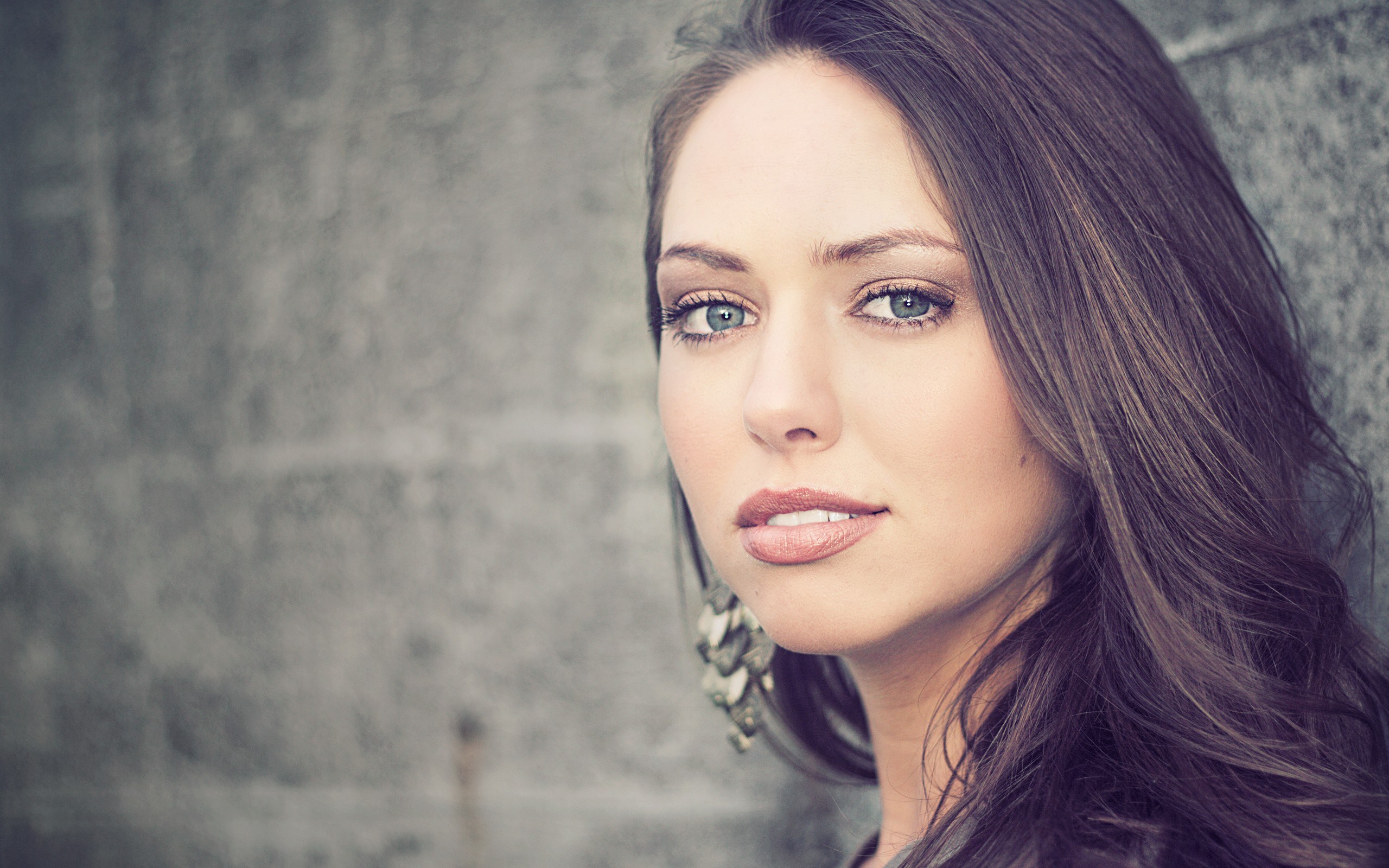 Woman with long brown hair and blue eyes HD Wallpaper