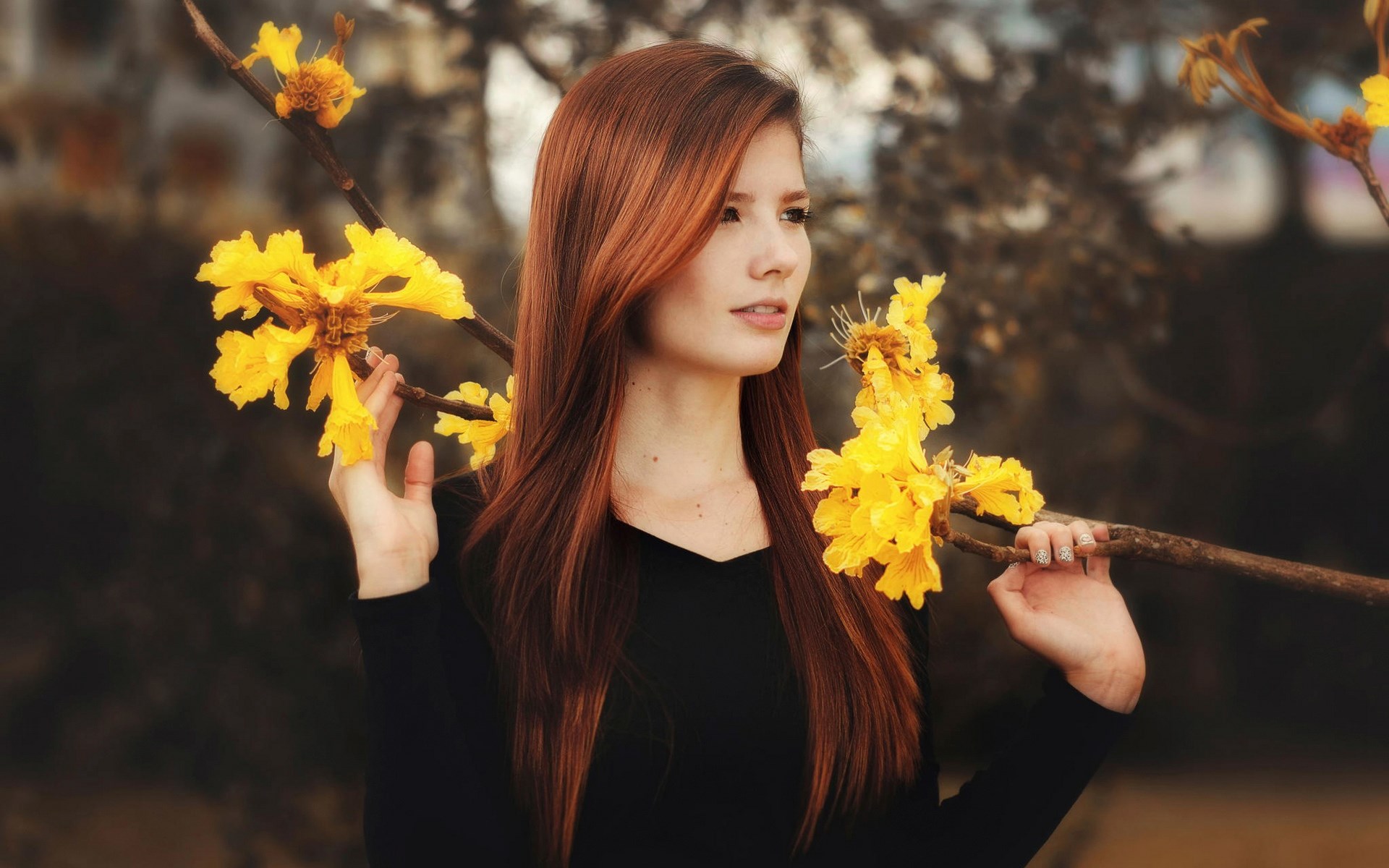 Woman with red hair holding yellow flowers HD Wallpaper