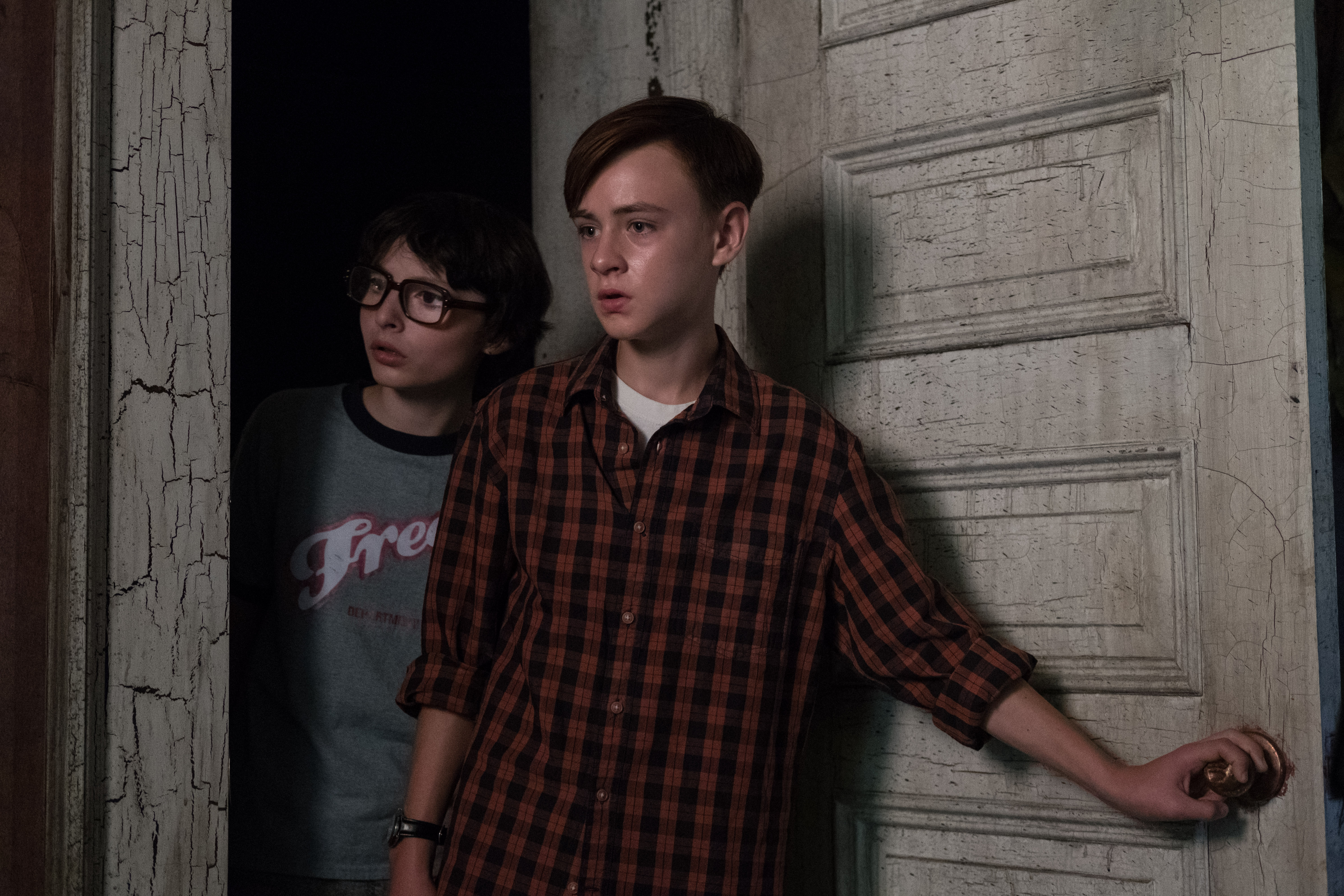 Finn Wolfhard and another boy in a doorway HD Wallpaper