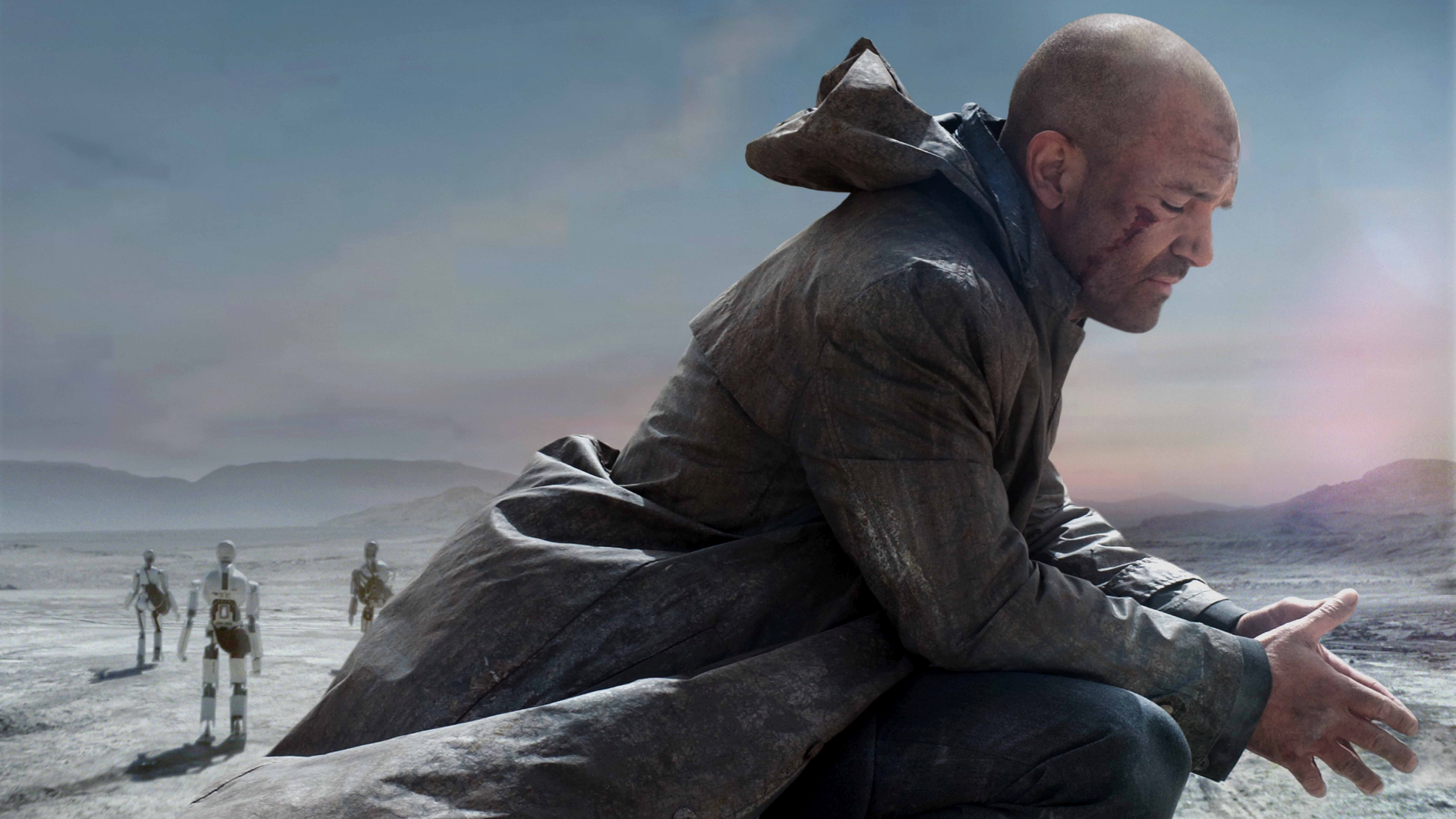 Antonio Banderas in a desolate landscape with robots HD Wallpaper
