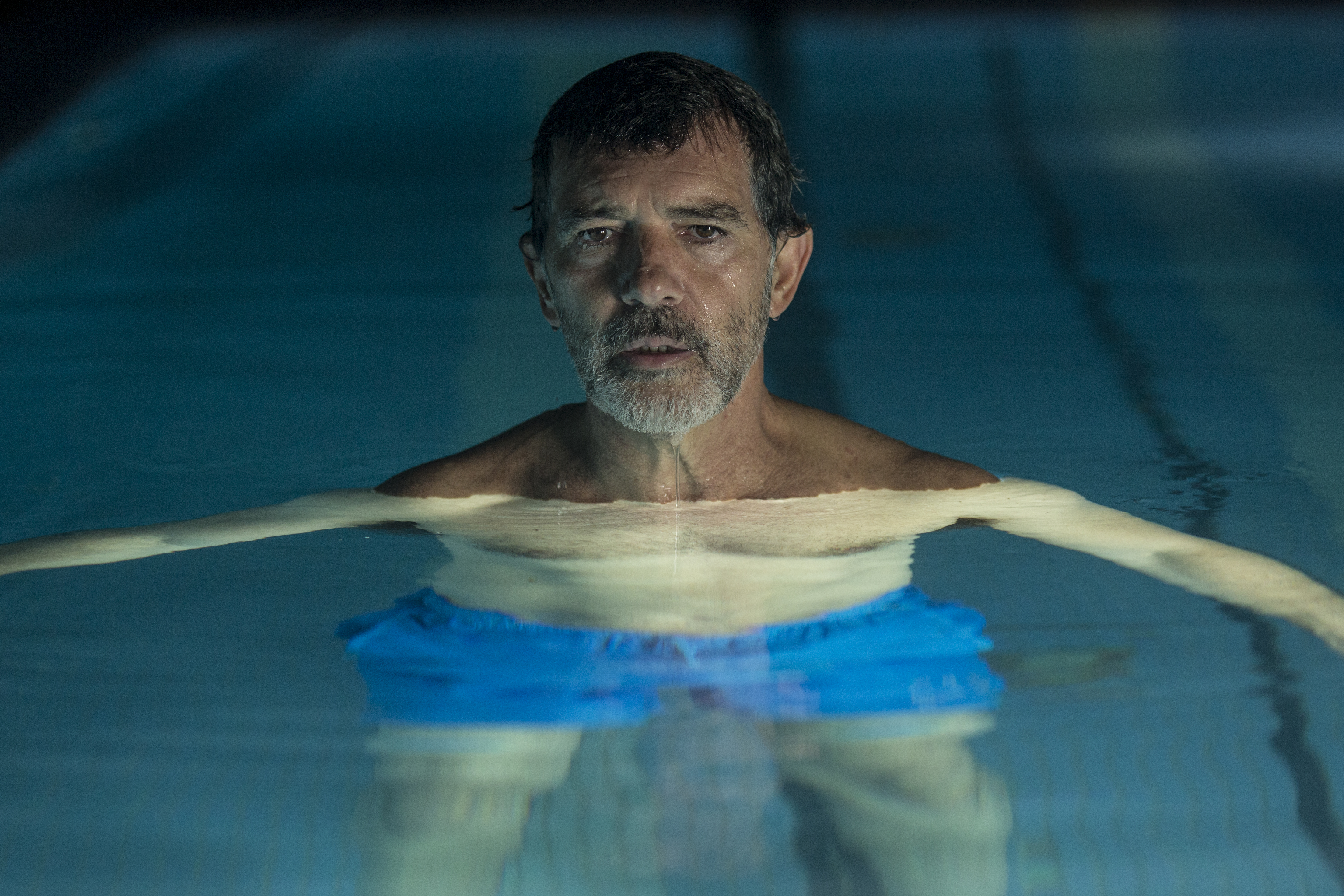 Antonio Banderas in a swimming pool HD Wallpaper