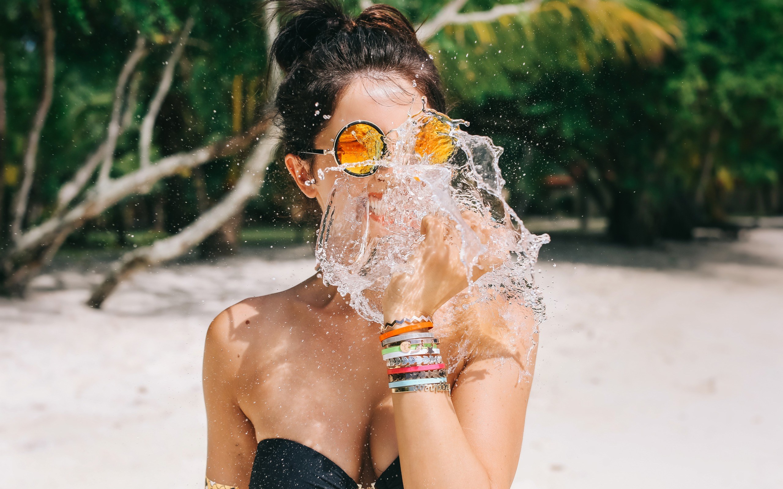 Woman splashing water on her face at the beach HD Wallpaper