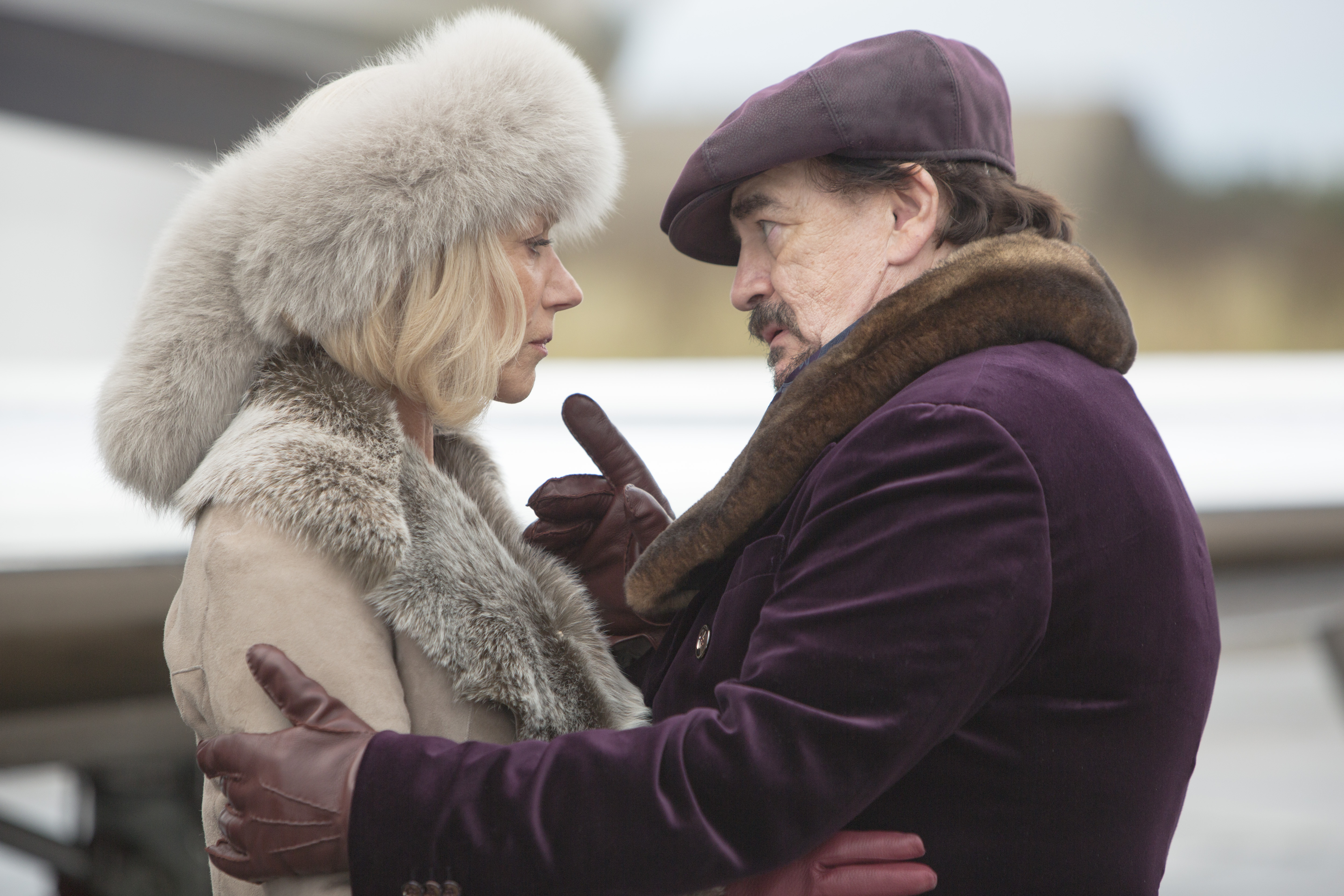 Helen Mirren and man in fur hats HD Wallpaper