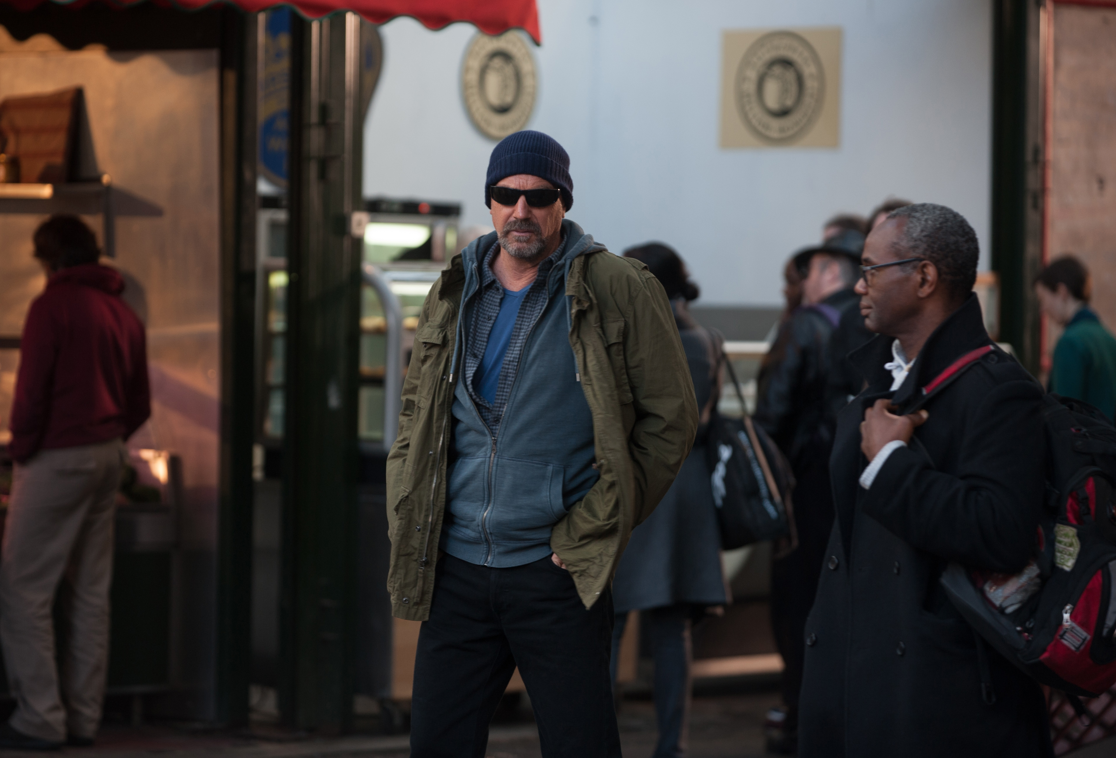 Kevin Costner in a street scene HD Wallpaper