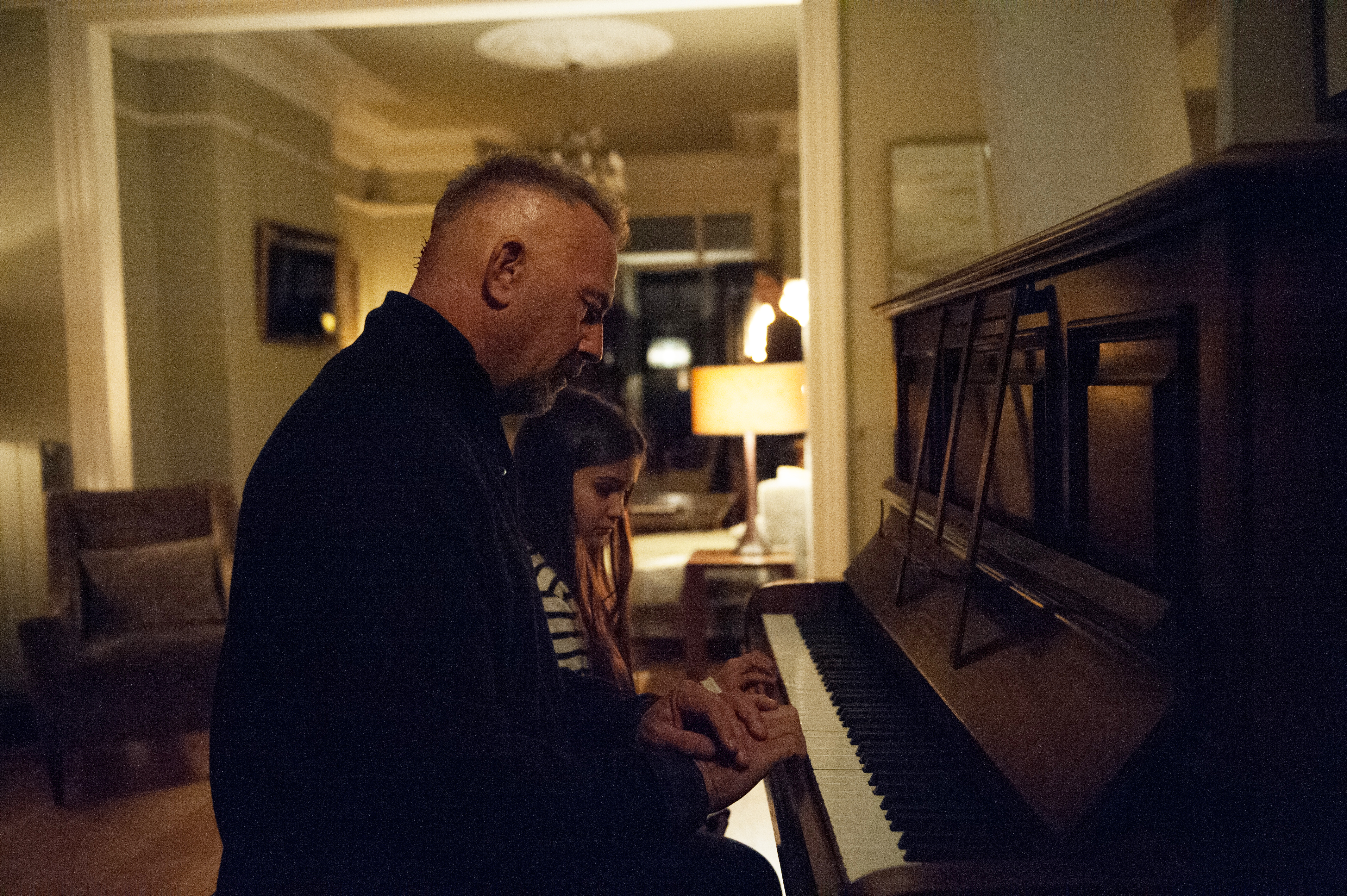 Kevin Costner and a girl playing piano HD Wallpaper