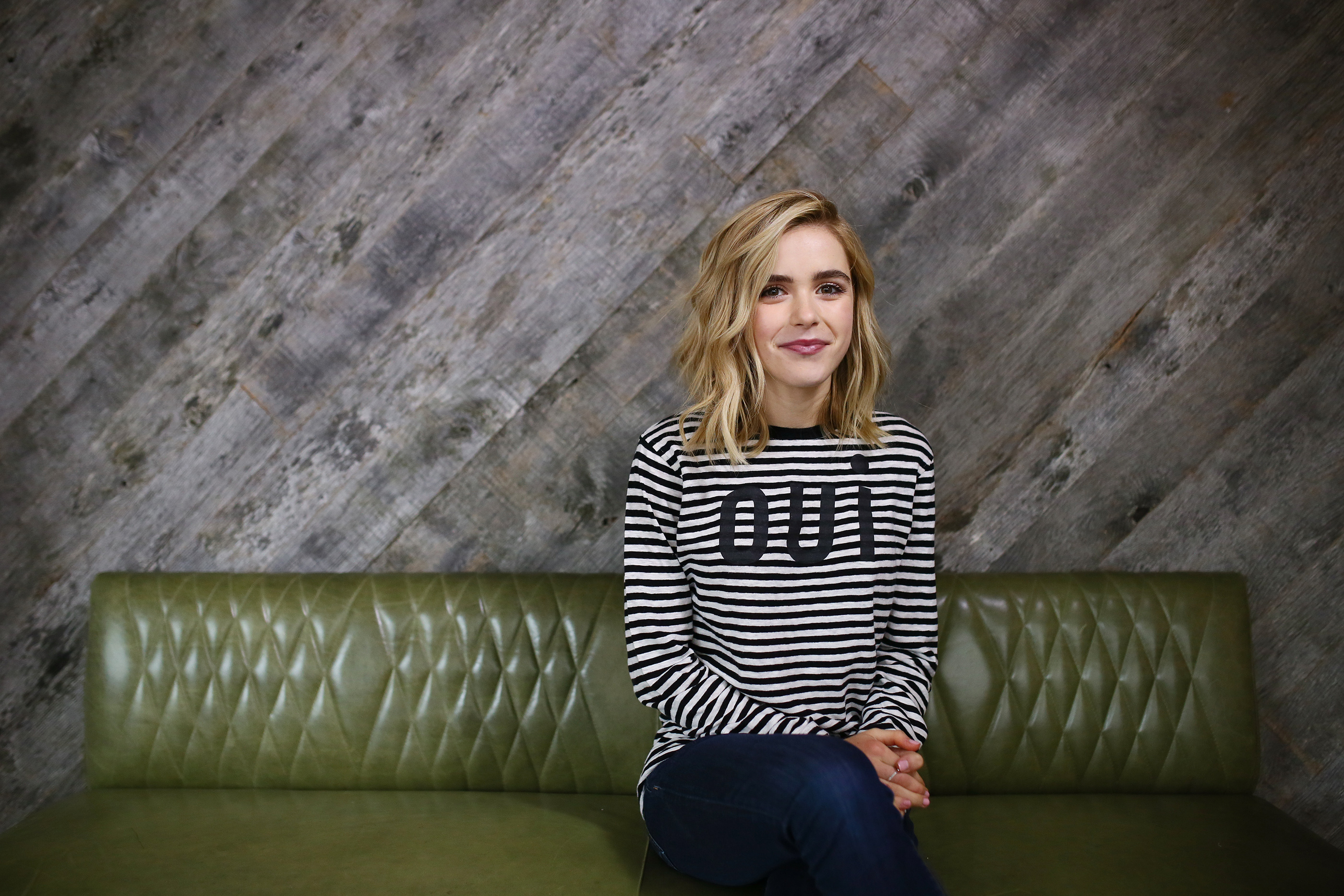 Kiernan Shipka sitting on a green couch HD Wallpaper