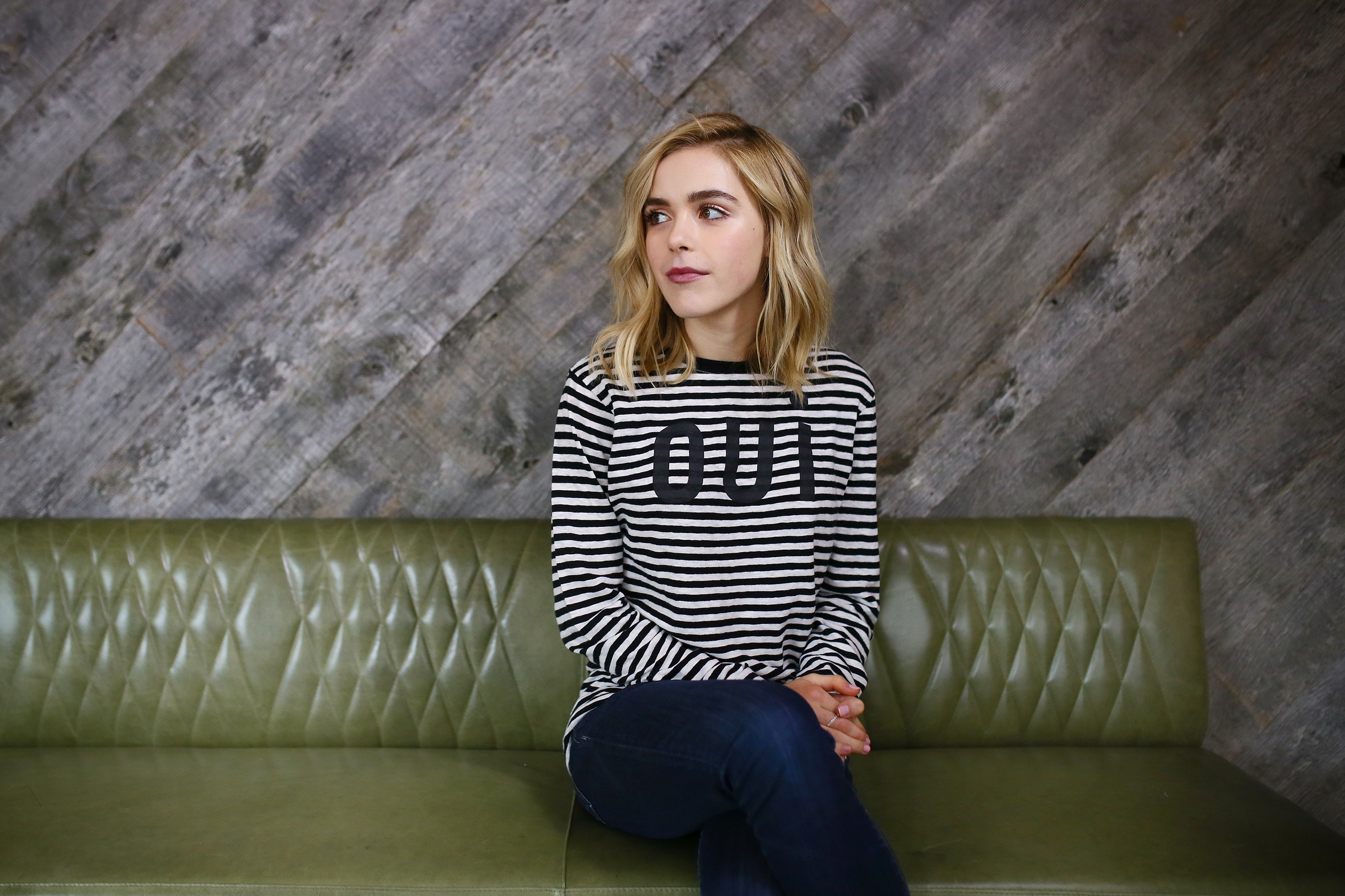 Kiernan Shipka sitting on a green couch HD Wallpaper