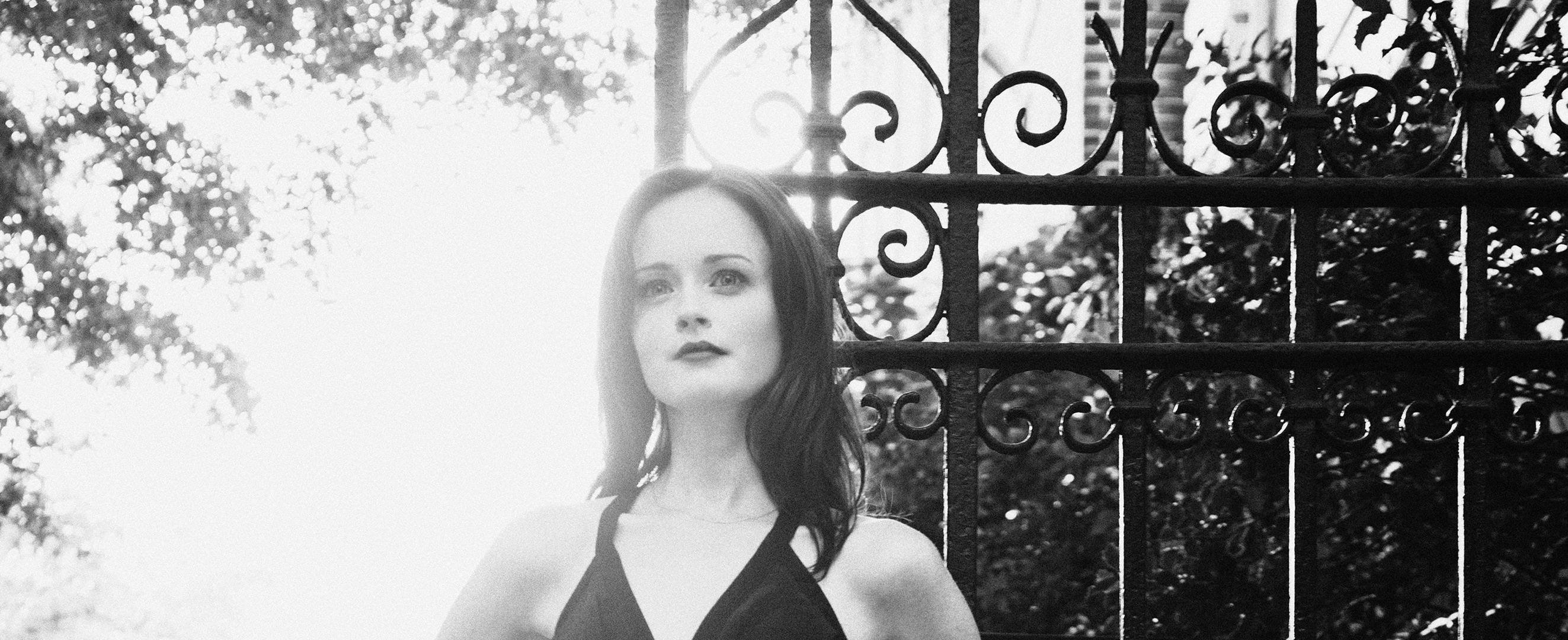 Alexis Bledel in front of a gate HD Wallpaper