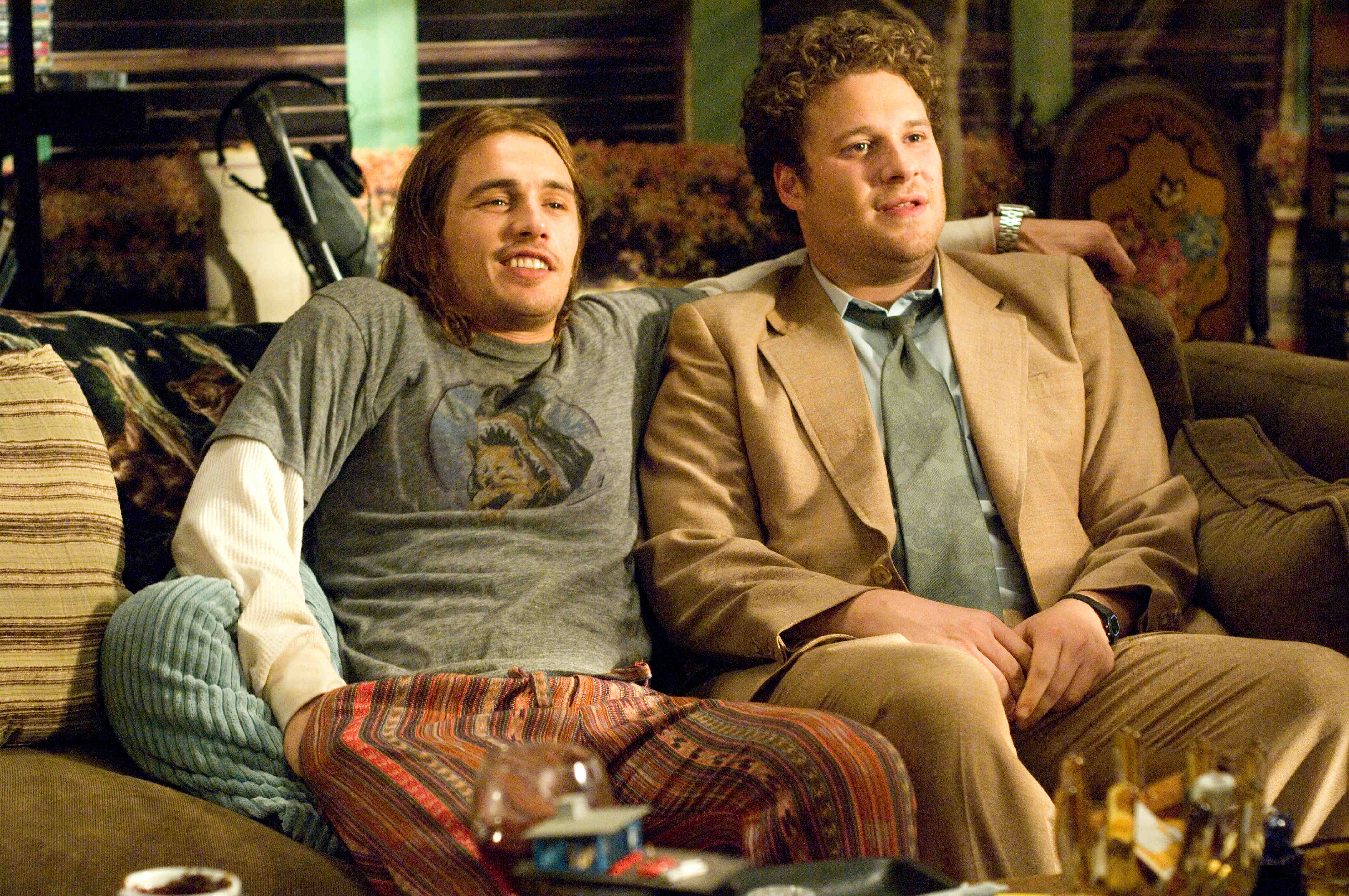 Seth Rogen and James Franco sitting on a couch HD Wallpaper