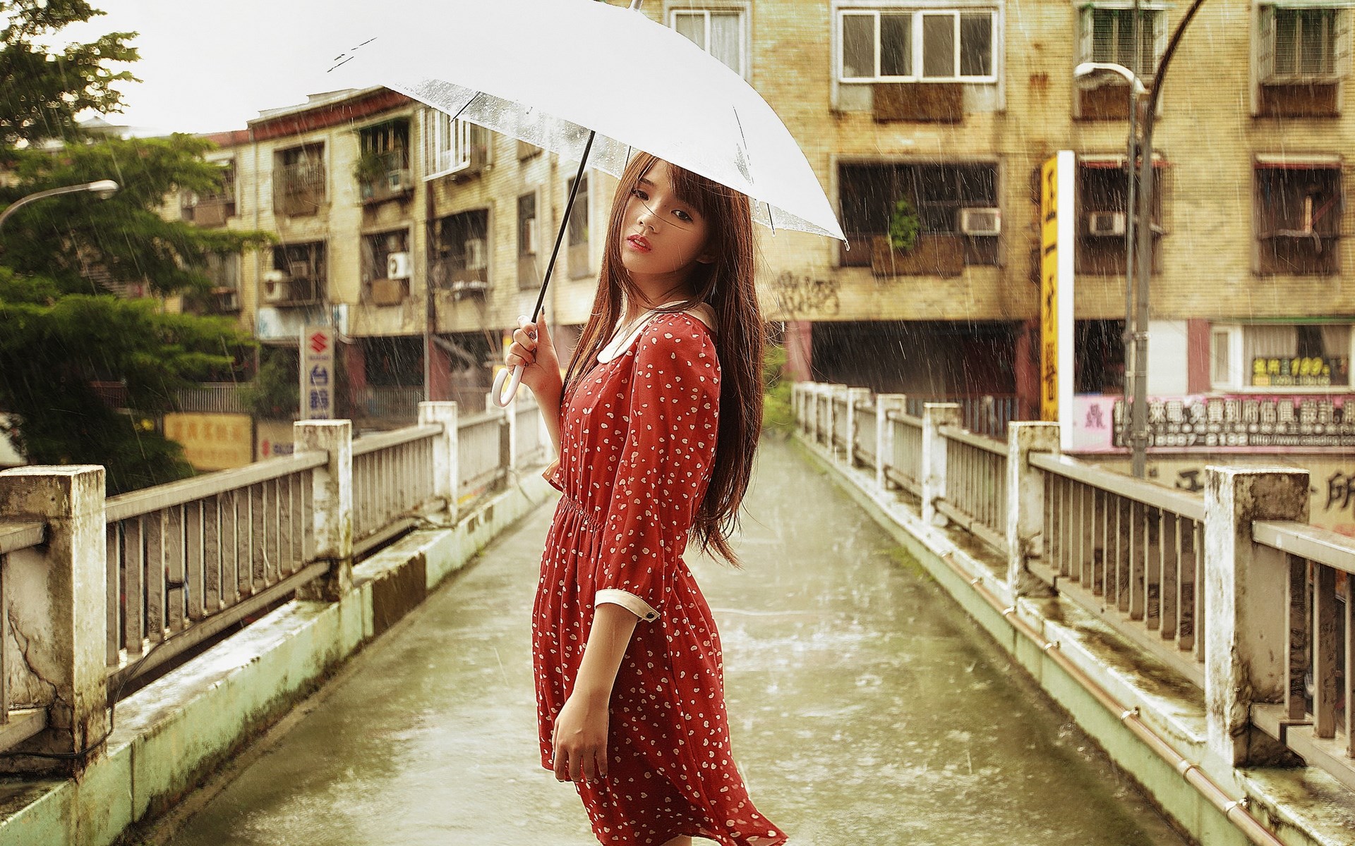 Girl with umbrella in the rain on a bridge HD Wallpaper