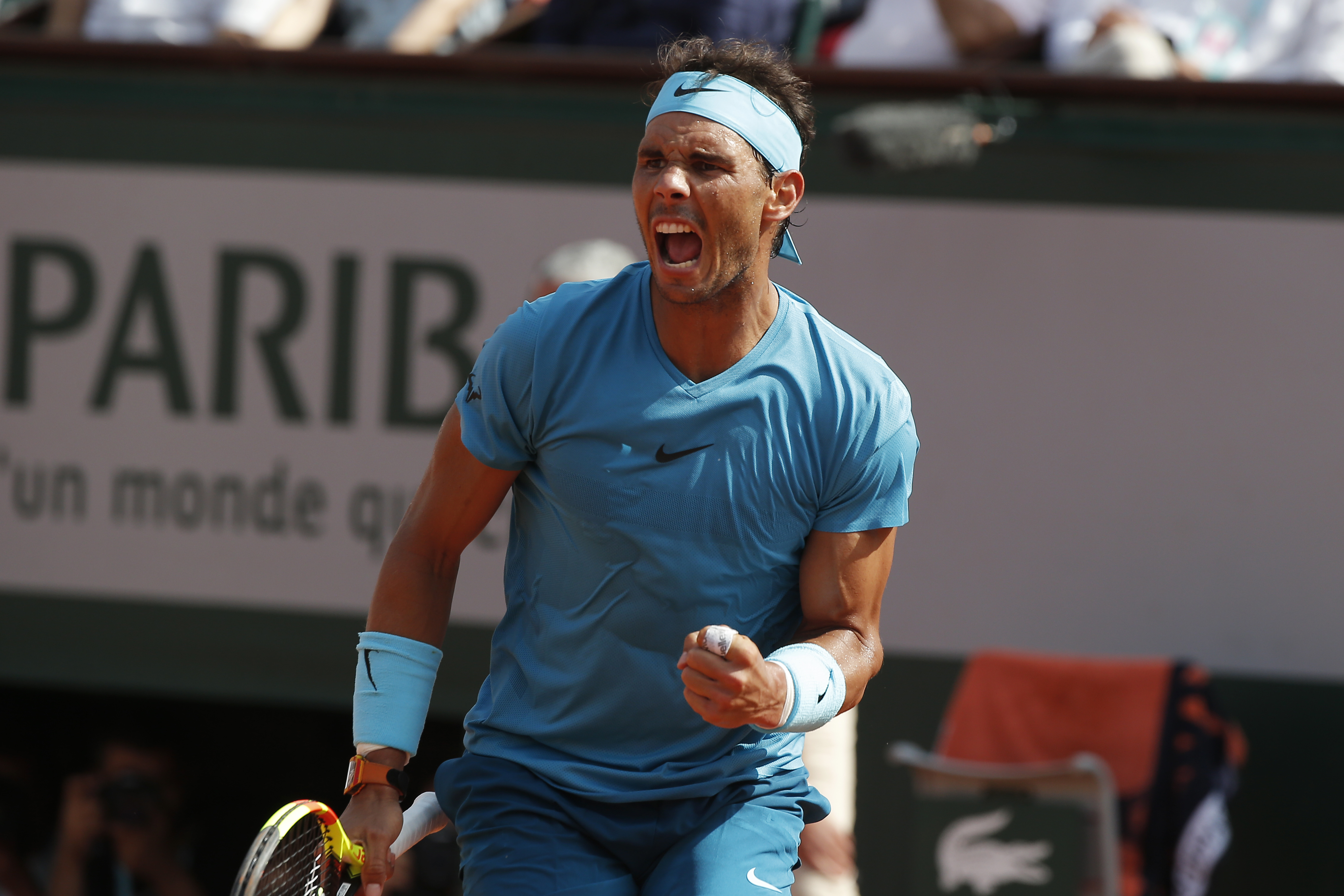 Rafael Nadal playing tennis at Roland Garros HD Wallpaper