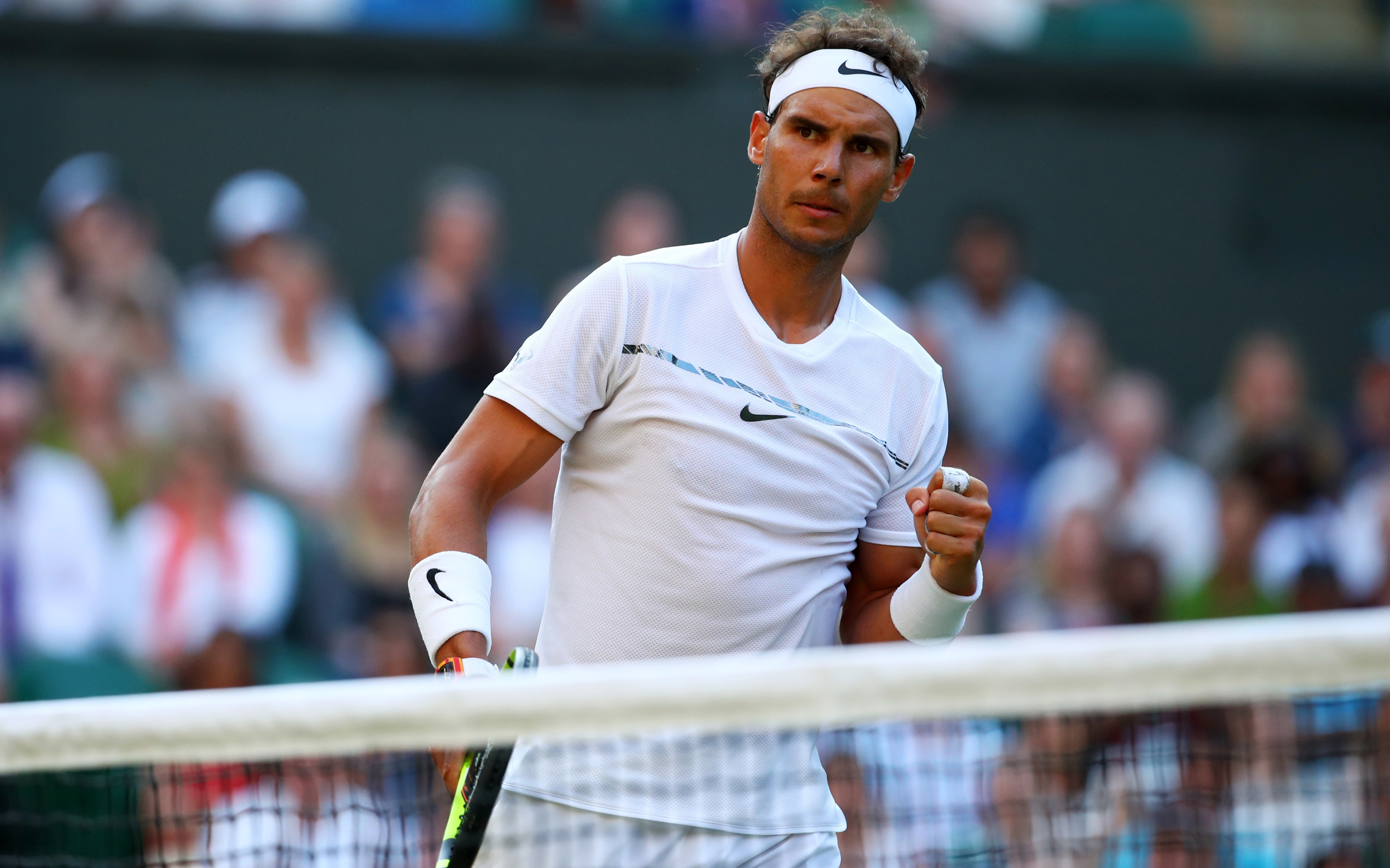 Rafael Nadal playing tennis at Wimbledon HD Wallpaper
