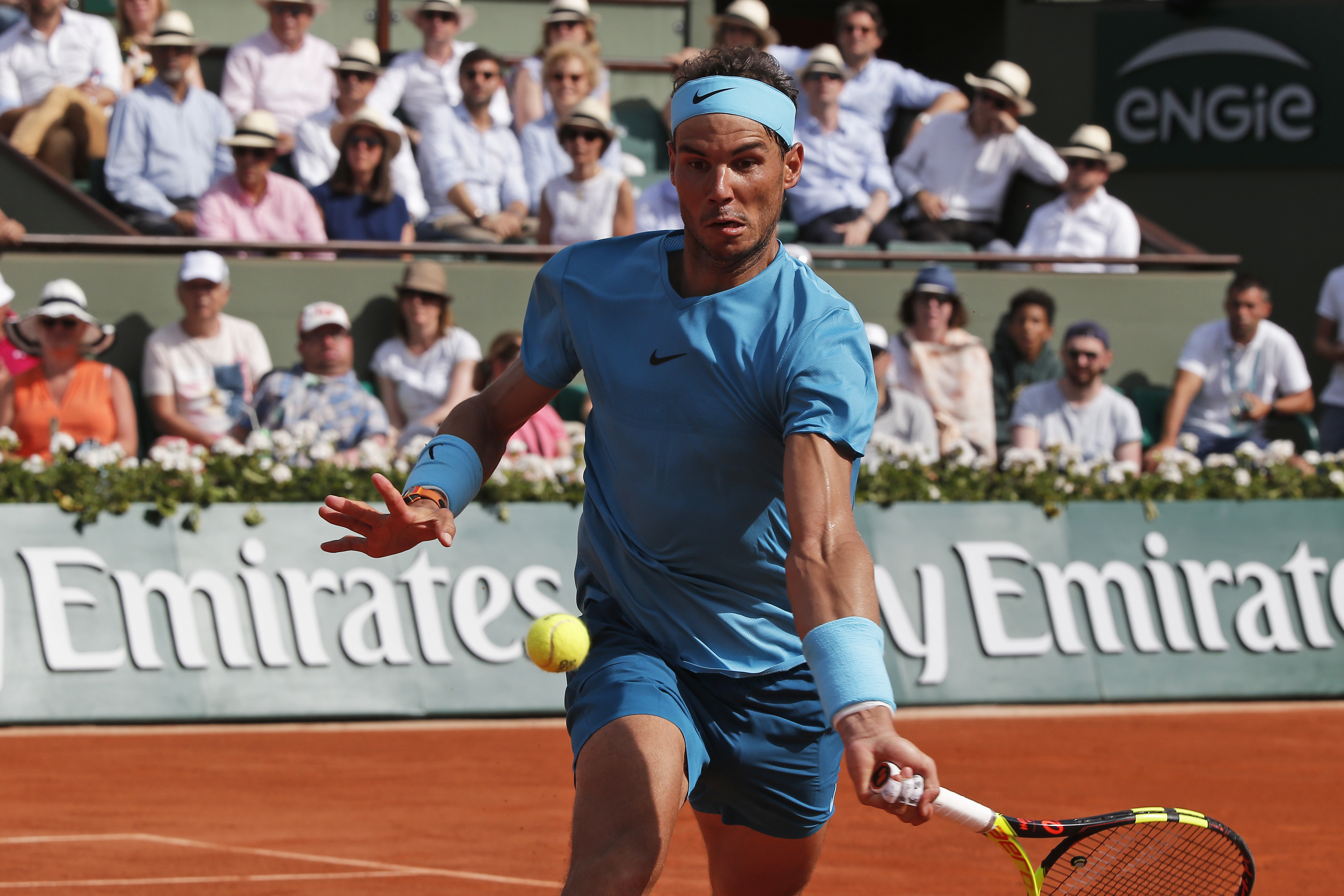 Rafael Nadal playing tennis at Roland Garros HD Wallpaper