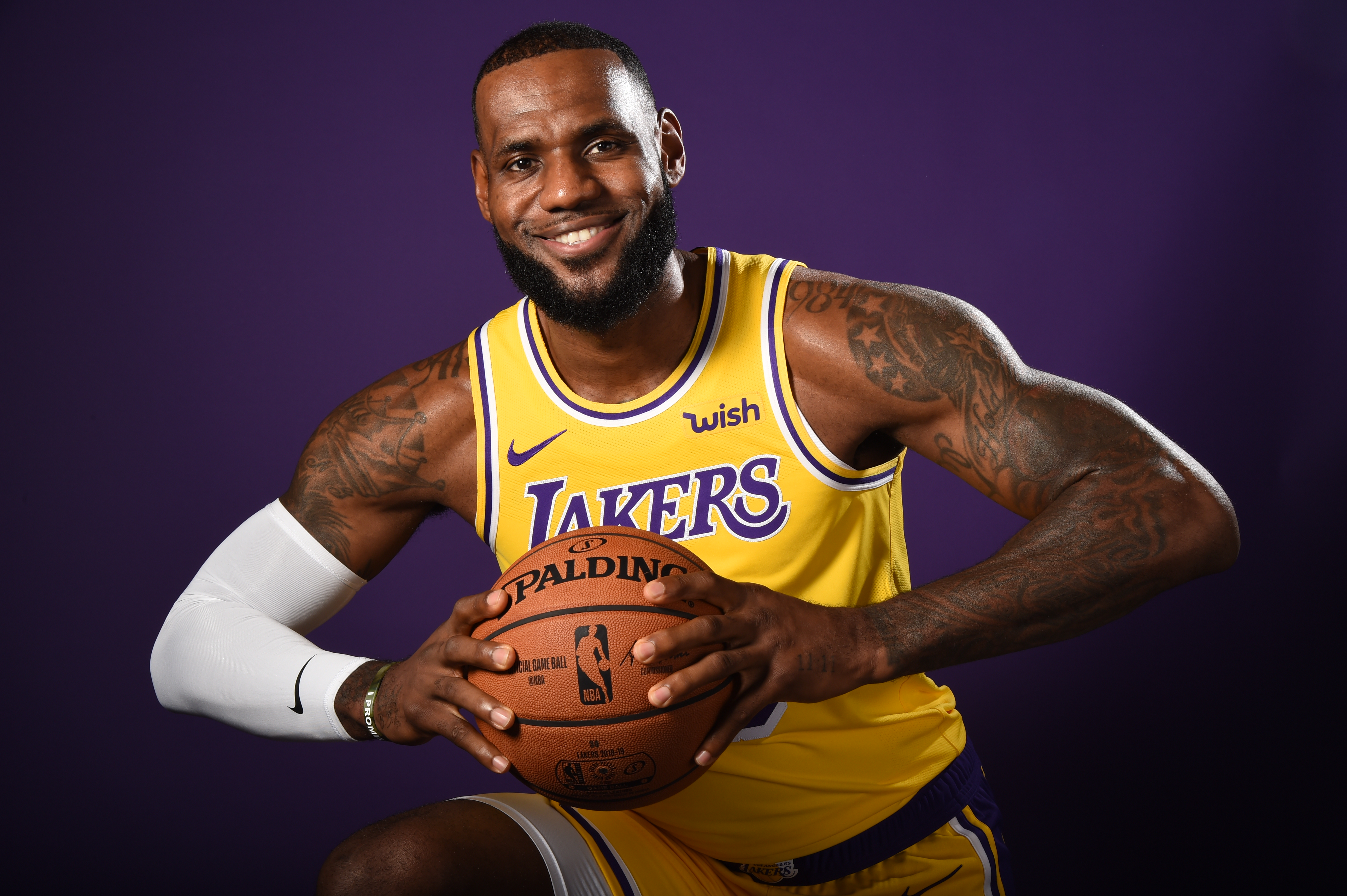 LeBron James in Lakers Jersey Holding Basketball HD Wallpaper