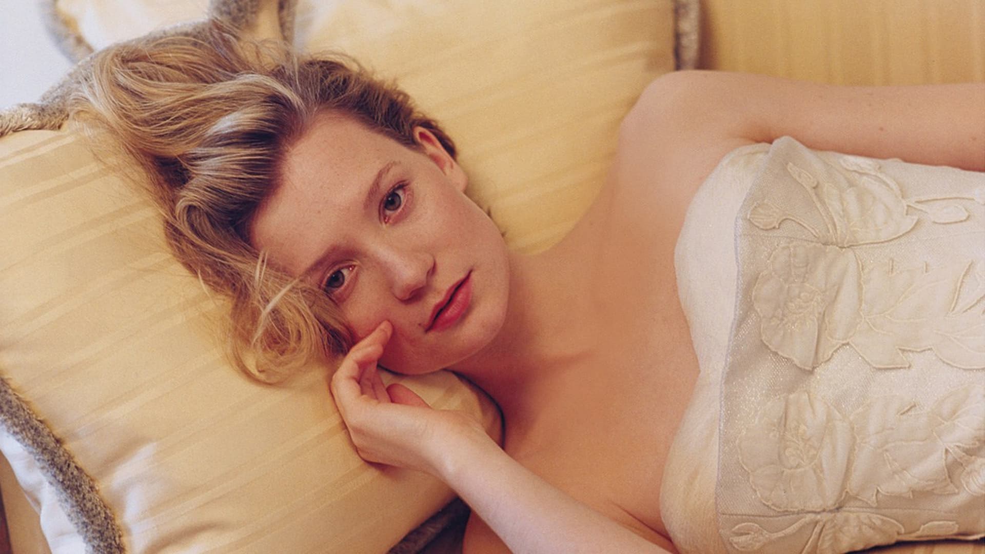 Mia Wasikowska lying on a couch HD Wallpaper