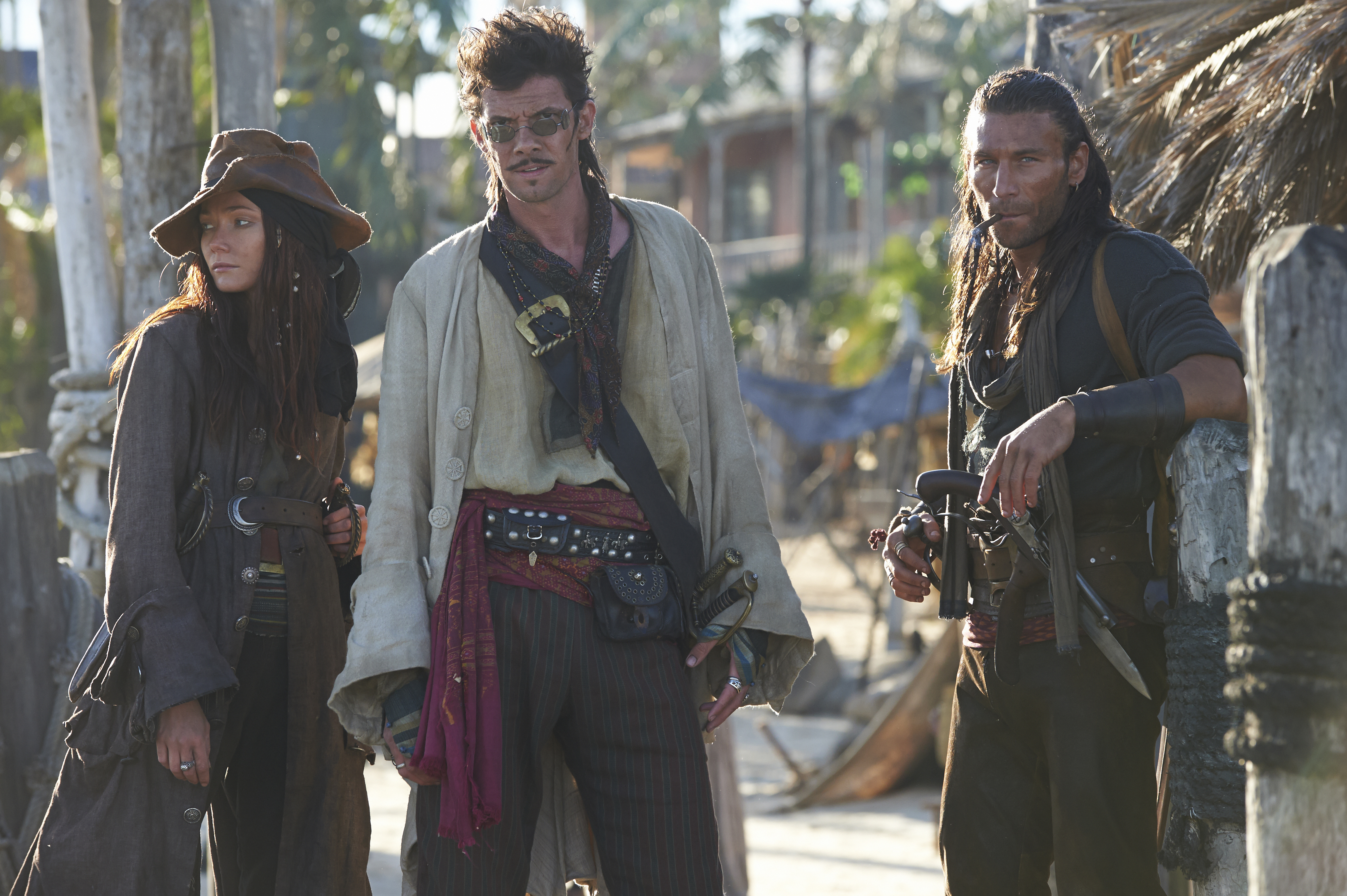 Toby Schmitz and two other pirates on a beach HD Wallpaper
