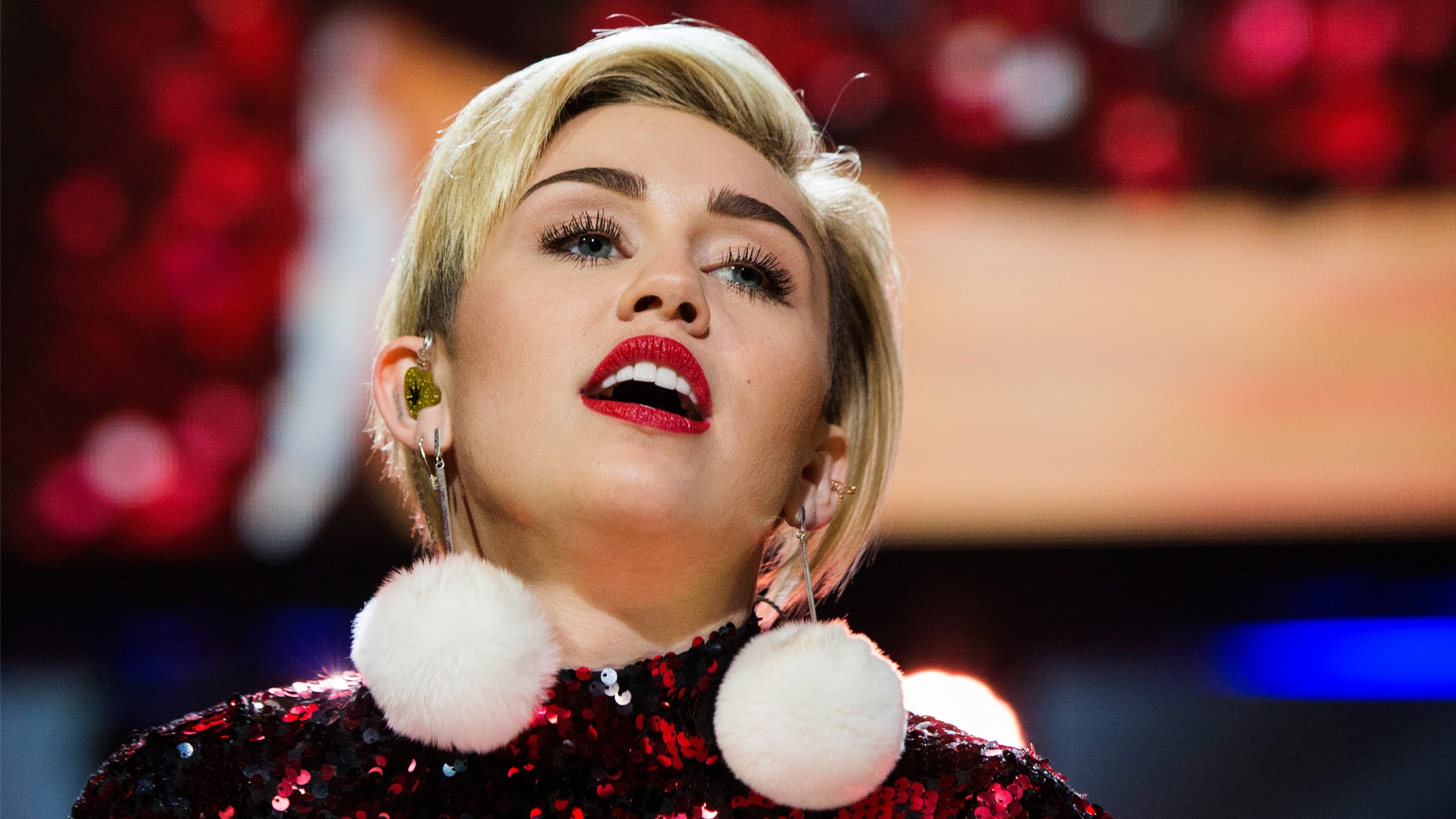 Miley Cyrus performing on stage HD Wallpaper