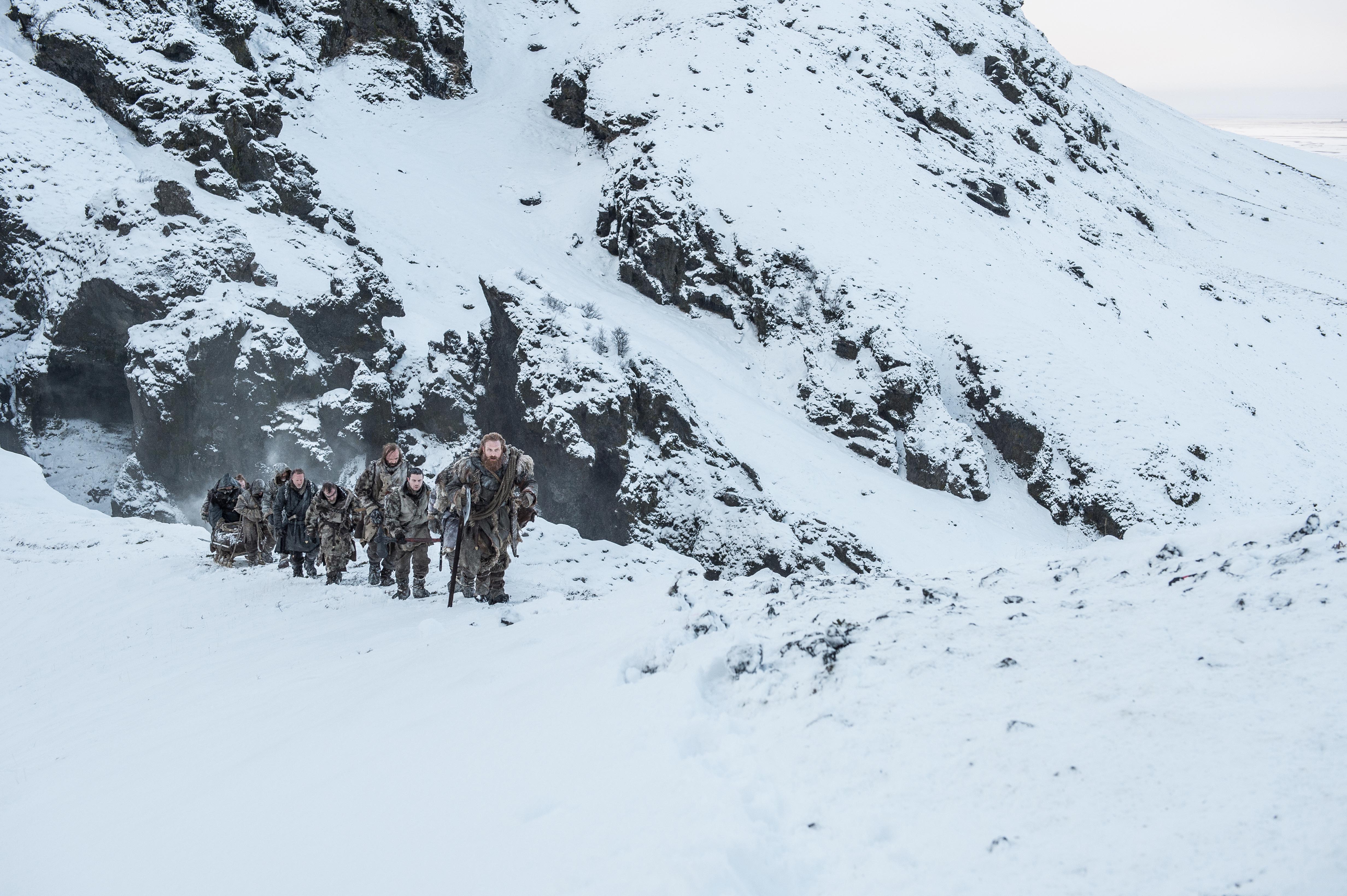 Joe Dempsie and group in snowy mountains HD Wallpaper