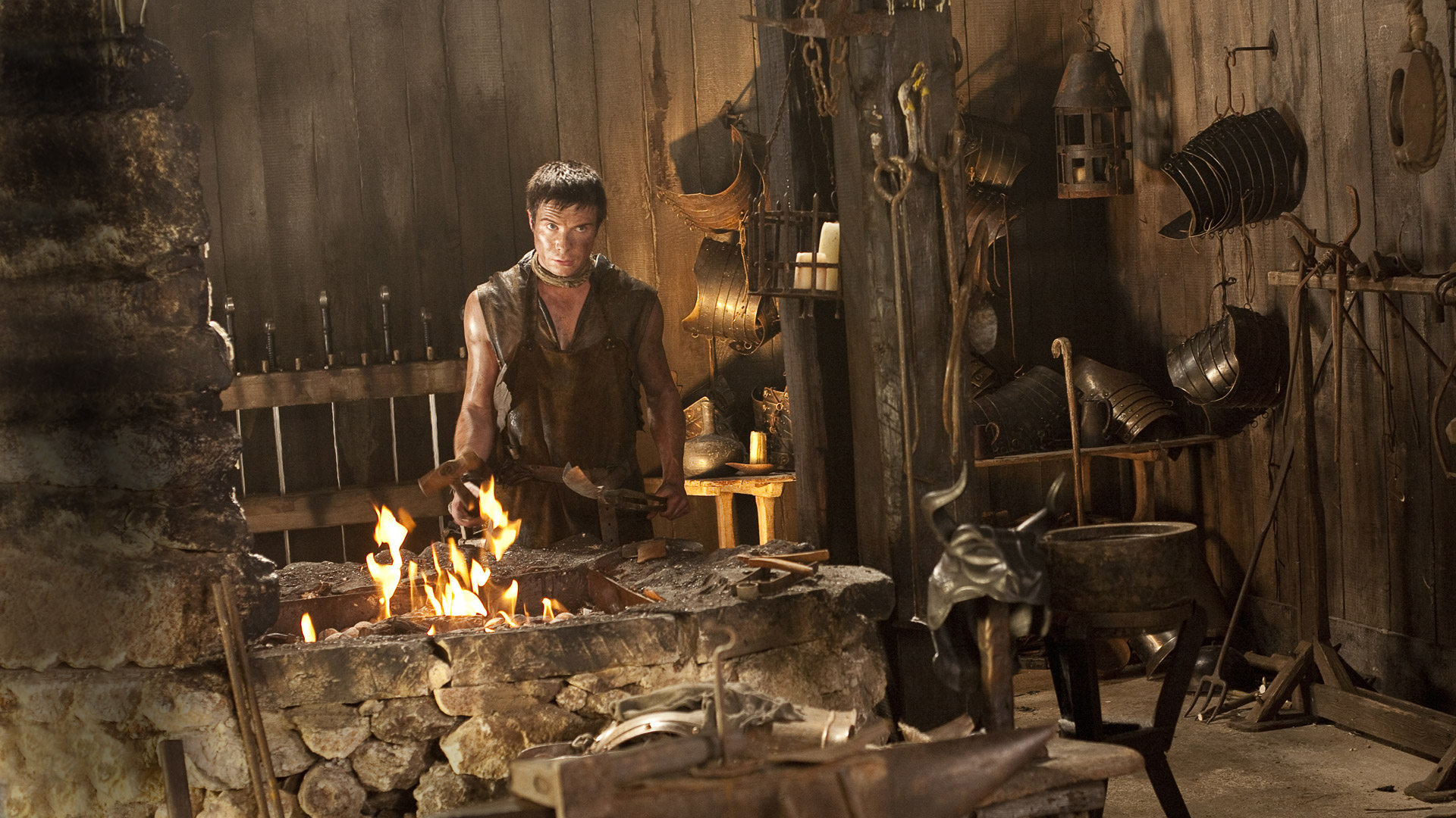 Joe Dempsie in a blacksmith's workshop HD Wallpaper