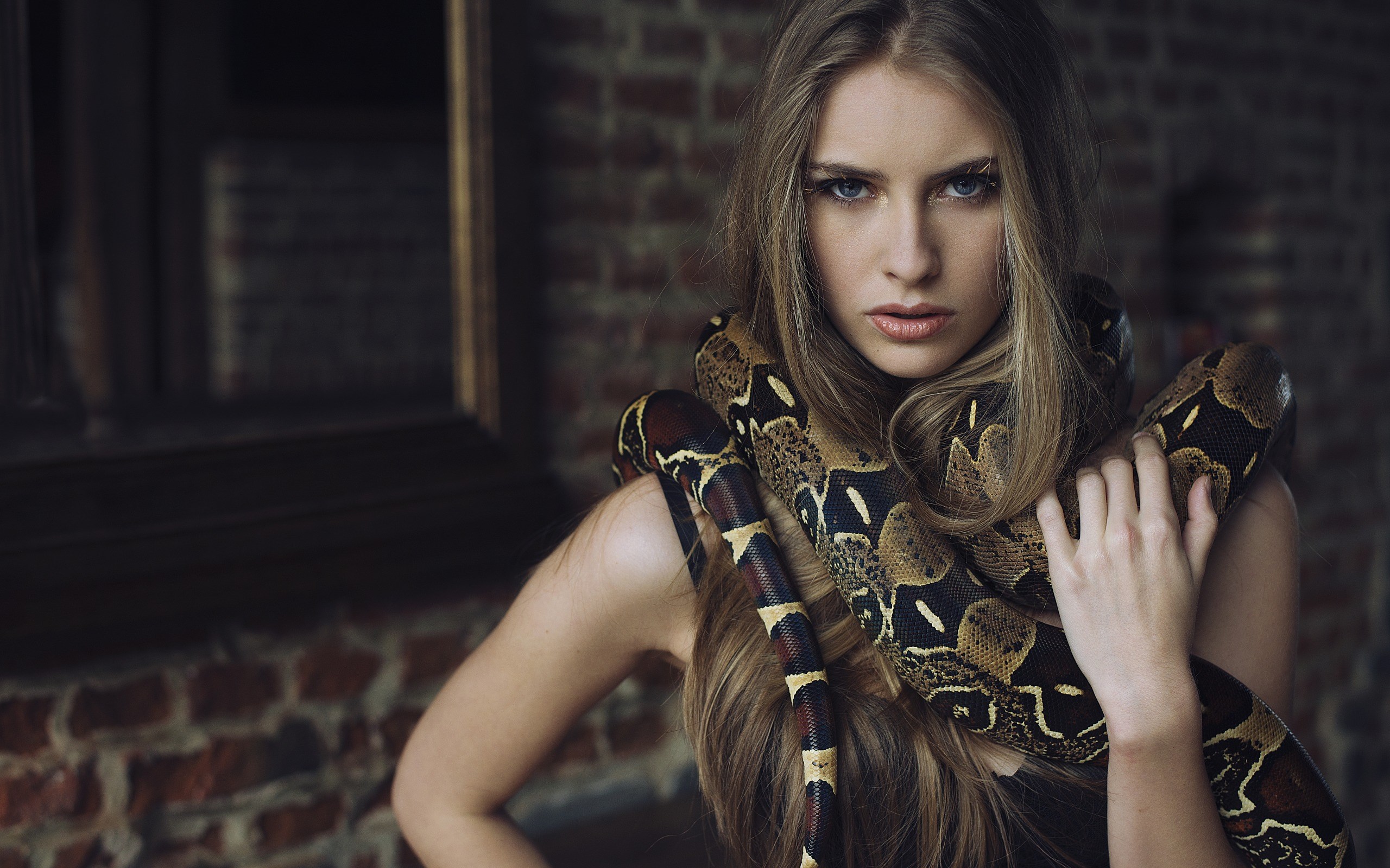Woman with a snake around her neck HD Wallpaper