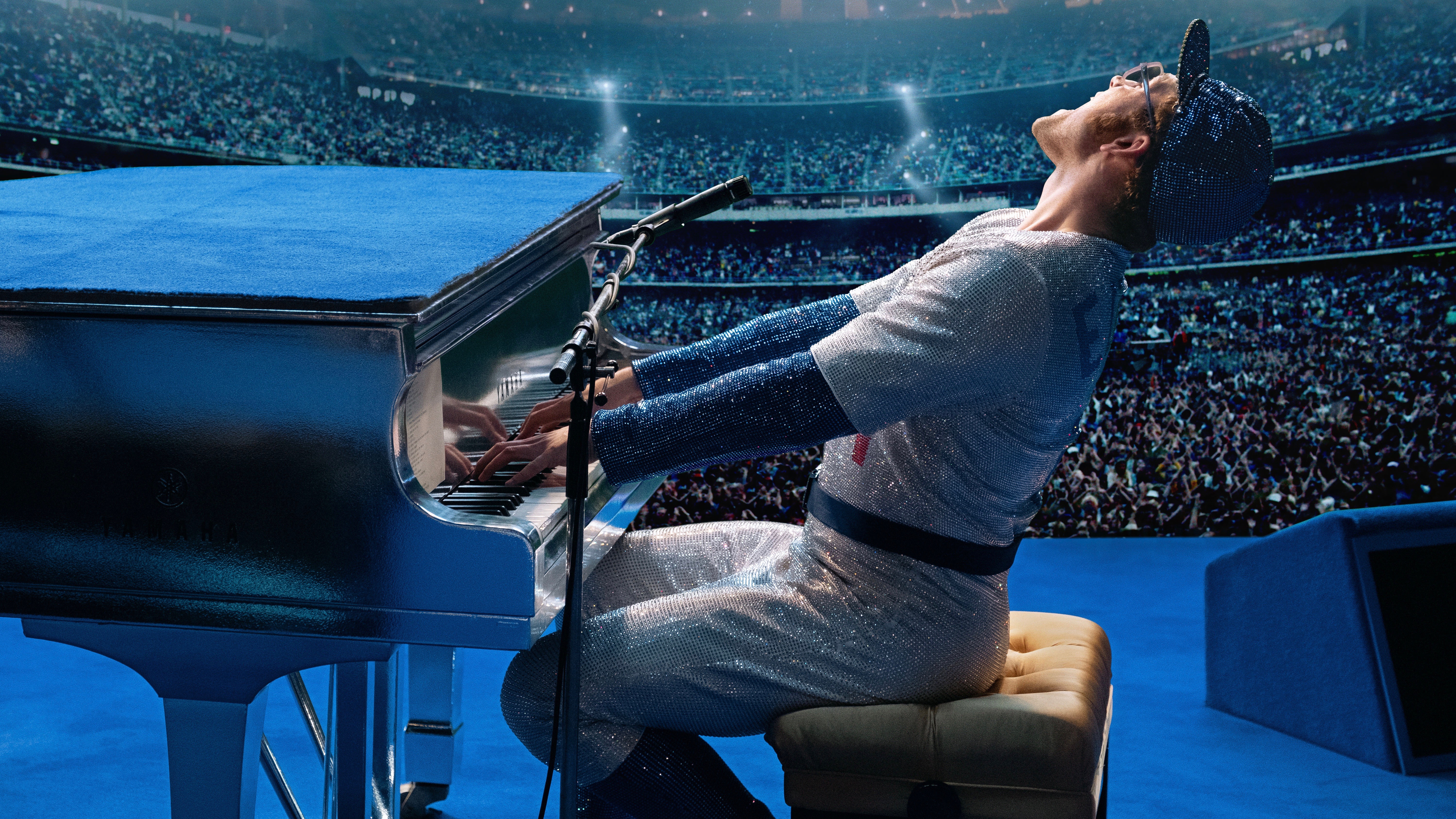 Taron Egerton as Elton John playing piano on stage HD Wallpaper