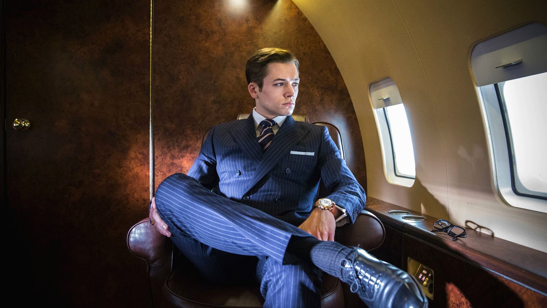 Taron Egerton in a private jet HD Wallpaper