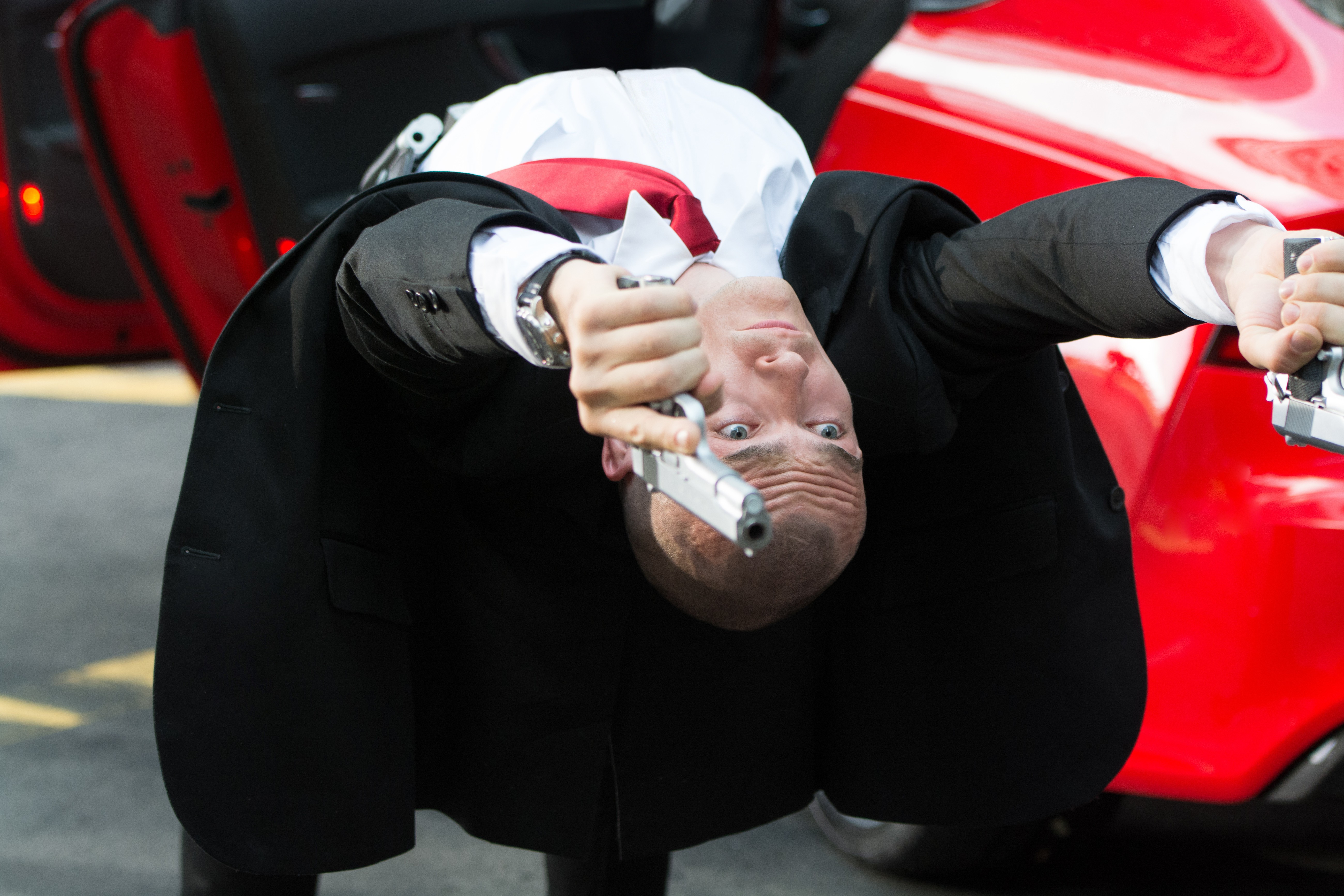 Rupert Friend as Agent 47 with guns HD Wallpaper