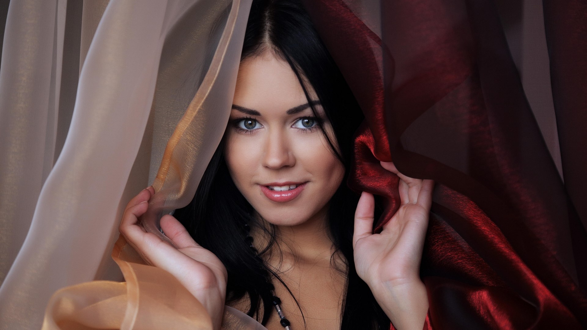 Woman peeking through sheer fabric HD Wallpaper