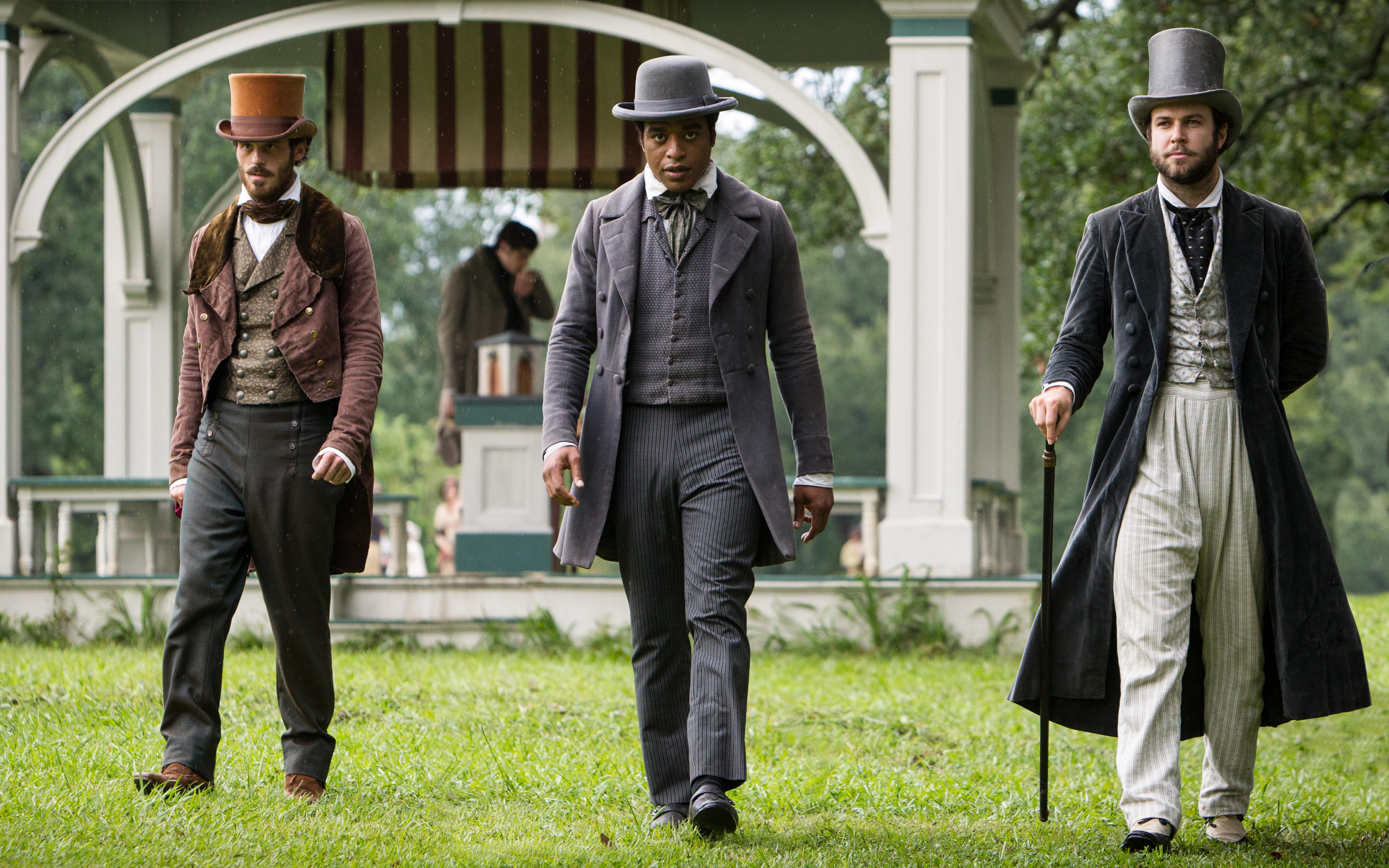 Three men in period attire standing outdoors HD Wallpaper