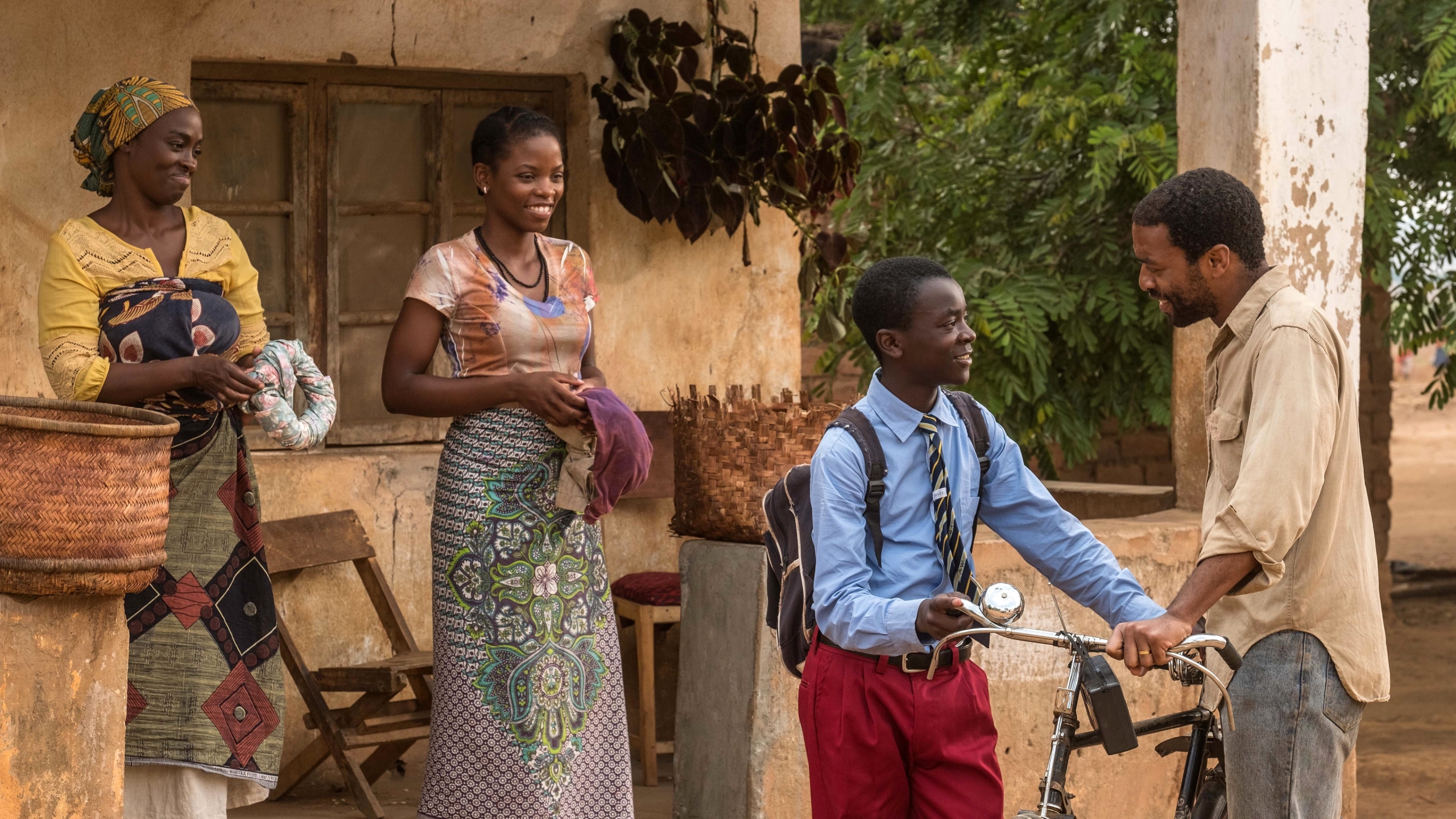 Chiwetel Ejiofor and children in a village HD Wallpaper
