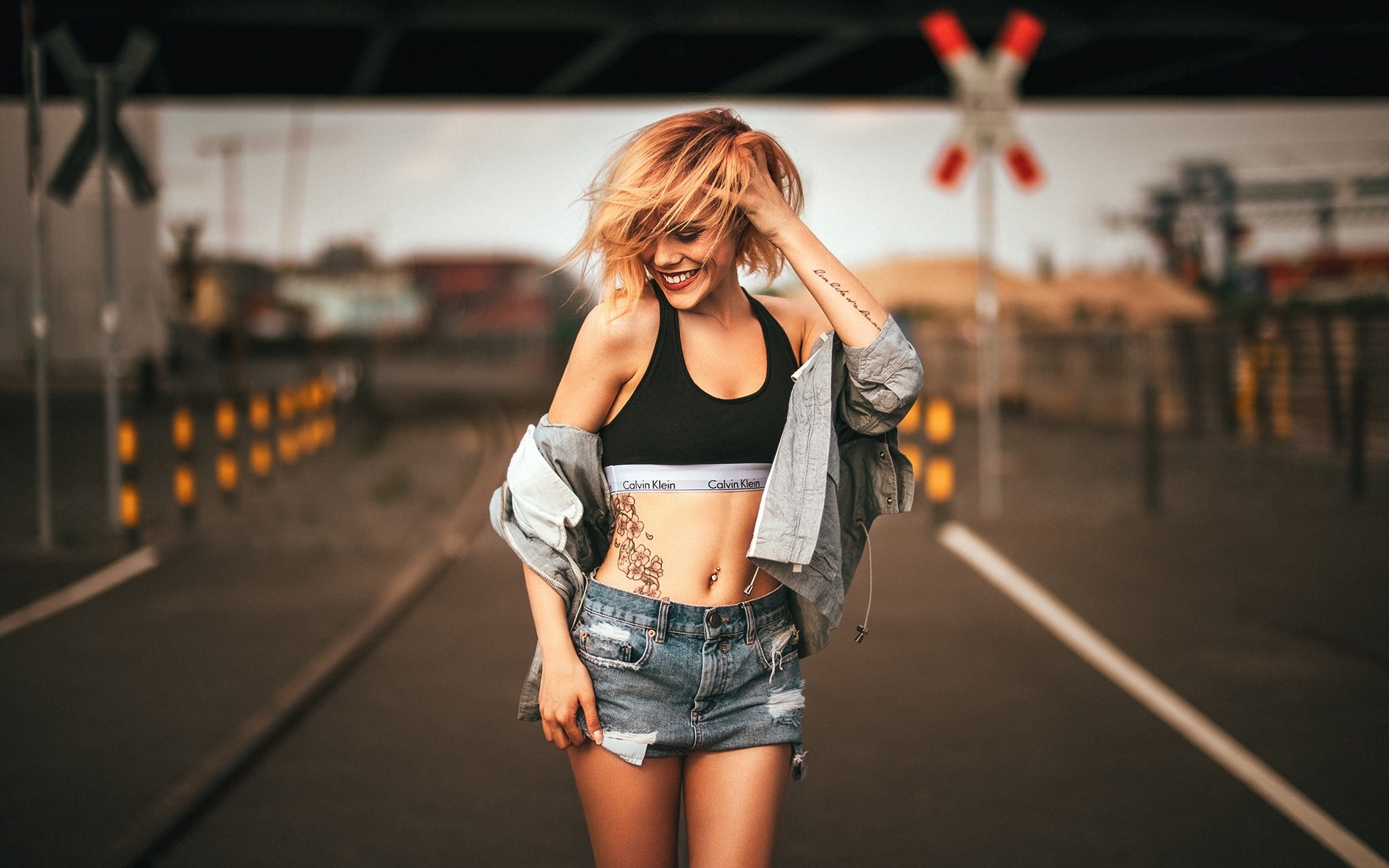 Woman in Calvin Klein bra and denim shorts HD Wallpaper