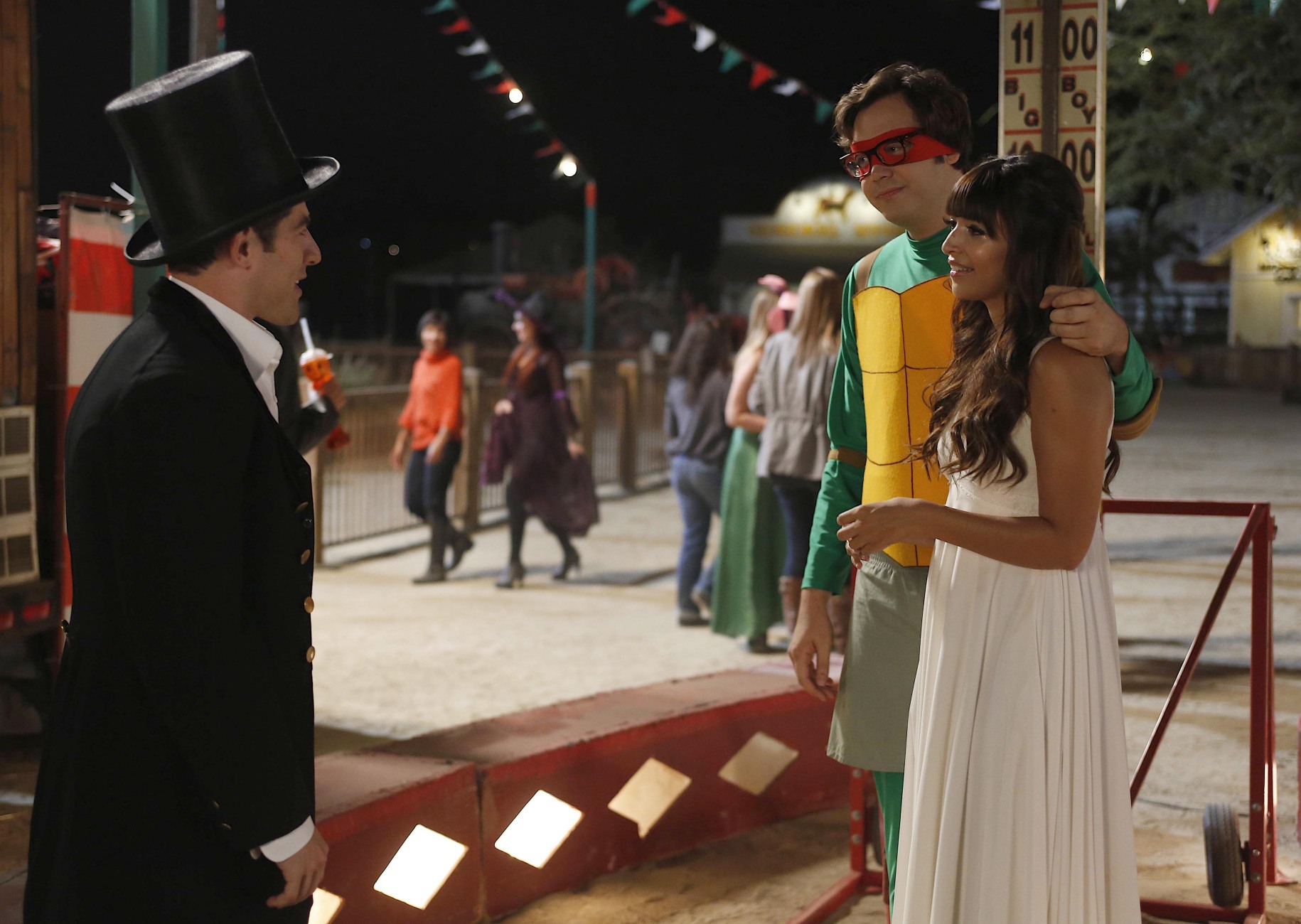 Hannah Simone and man in costume at carnival HD Wallpaper