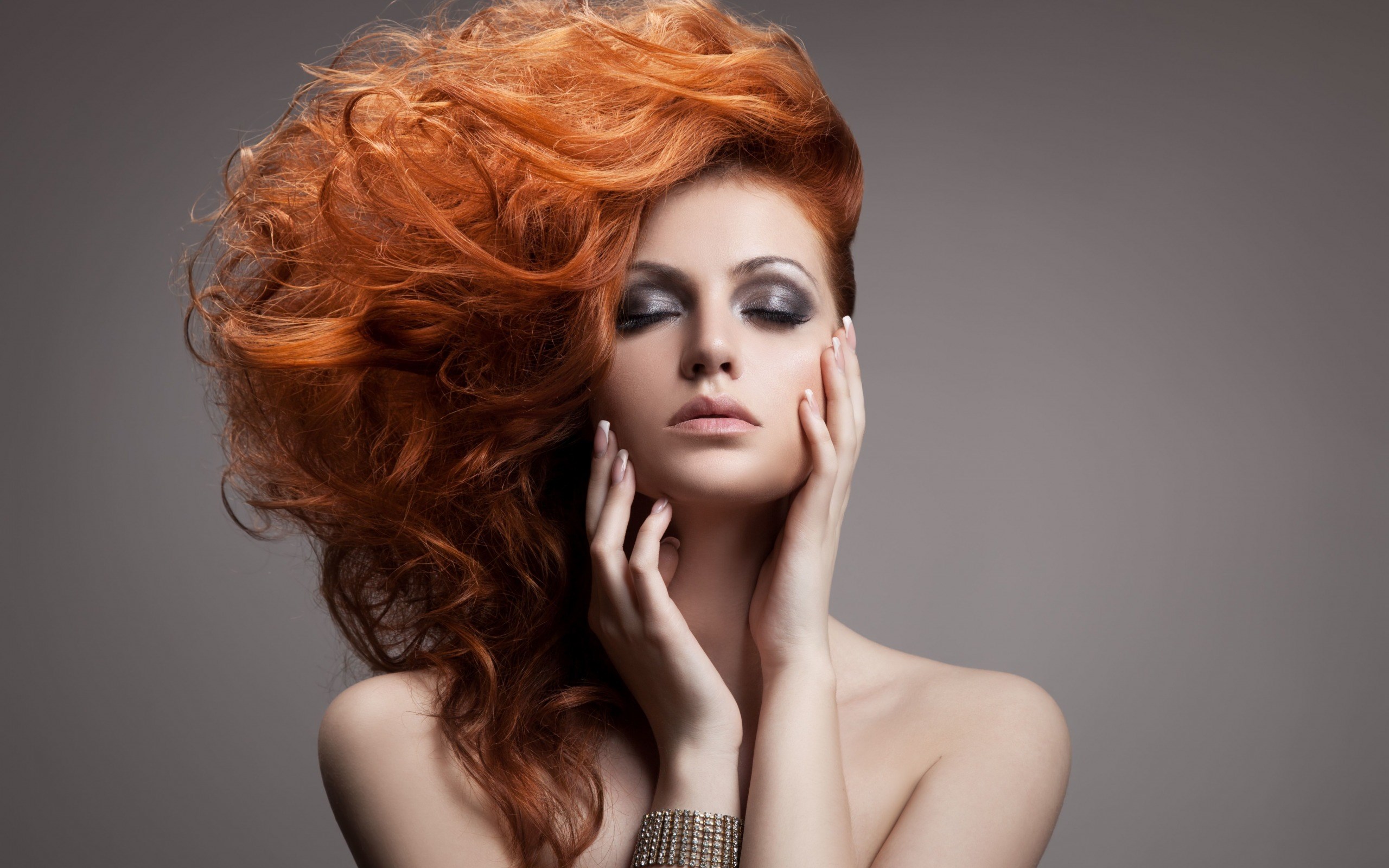 Woman with voluminous red hair and dramatic makeup HD Wallpaper