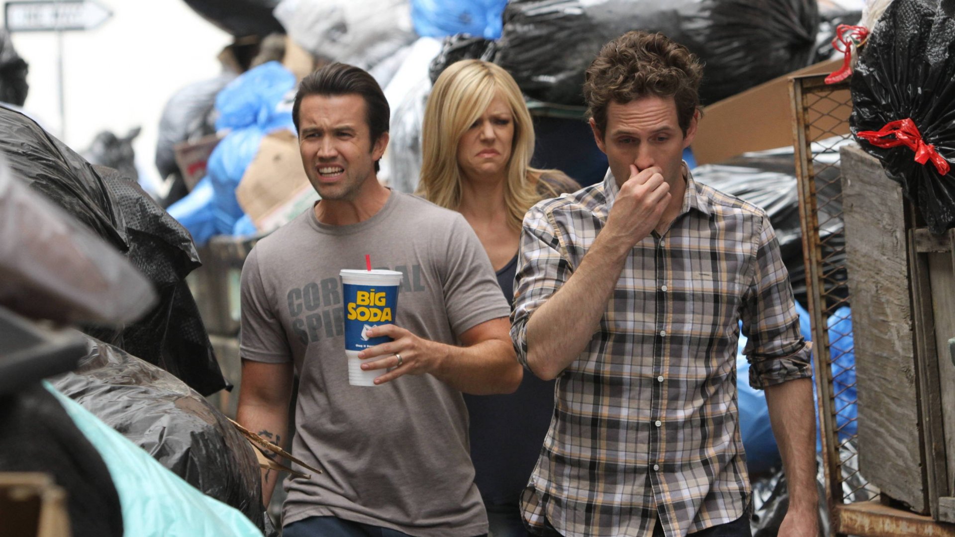 Kaitlin Olson and two men in trash HD Wallpaper